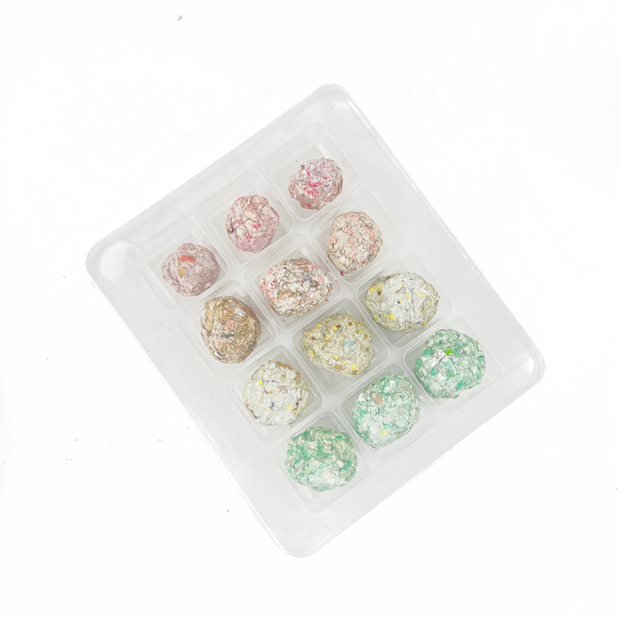Open 12 Days of Planting Seed Ball Set tray displaying colorful handmade seed balls from above