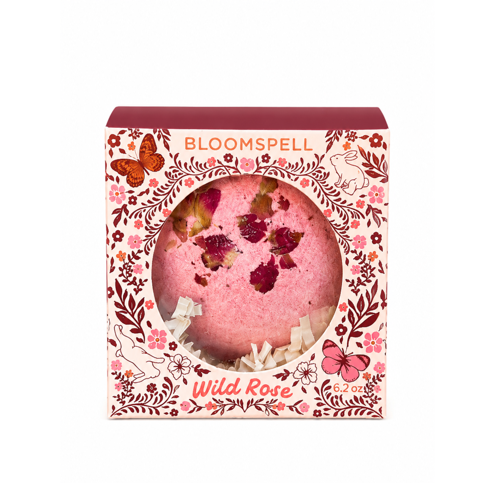 Bloomspell Wild Rose handcrafted botanical bath bomb in an illustrated storybook gift box topped with real dried rose petals, perfect for relaxing baths and thoughtful gifts.