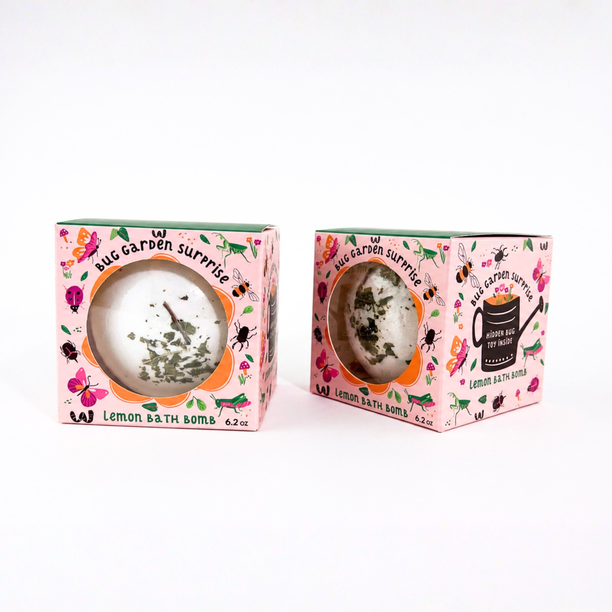 Two Bug Garden Surprise Lemon Bath Bombs by Sow the Magic® displayed on a bright white background, showing both the front and angled side of the whimsical packaging with a hidden bug toy inside and botanical lemon bath bomb.