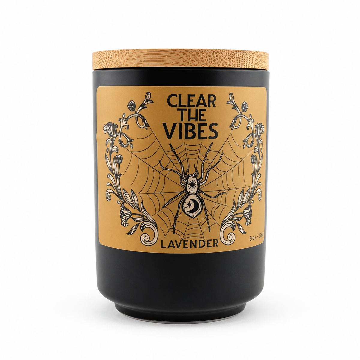Clear the Vibes Lavender candle in a matte black jar with a bamboo lid and gold spiderweb label