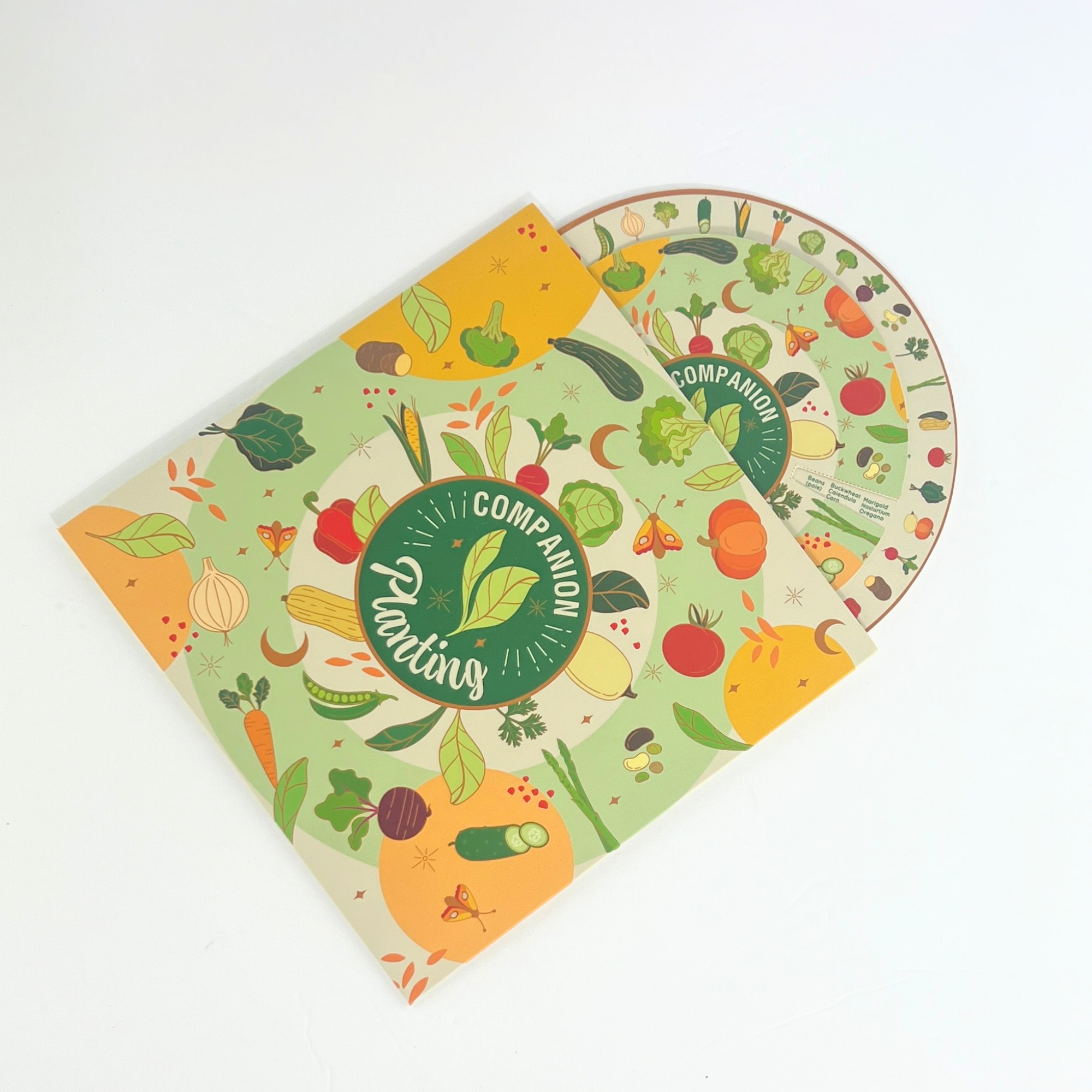 Companion planting reference chart and gardening booklet with vibrant vegetable artwork for crop planning.