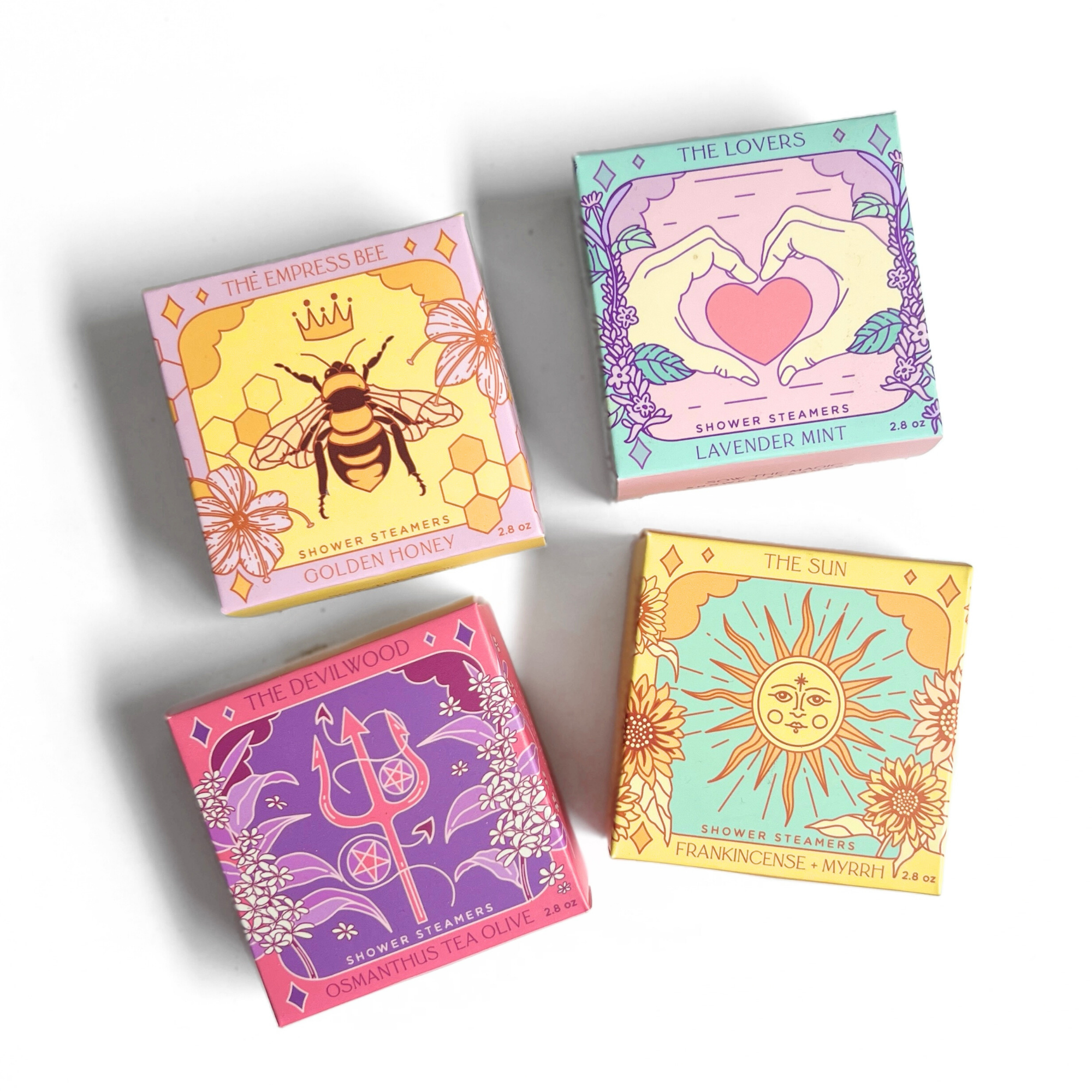 Complete Tarot Shower Steamer Collection by Sow the Magic® featuring The Devilwood, The Empress Bee, The Lovers, and The Sun botanical aromatherapy shower steamer gift sets.