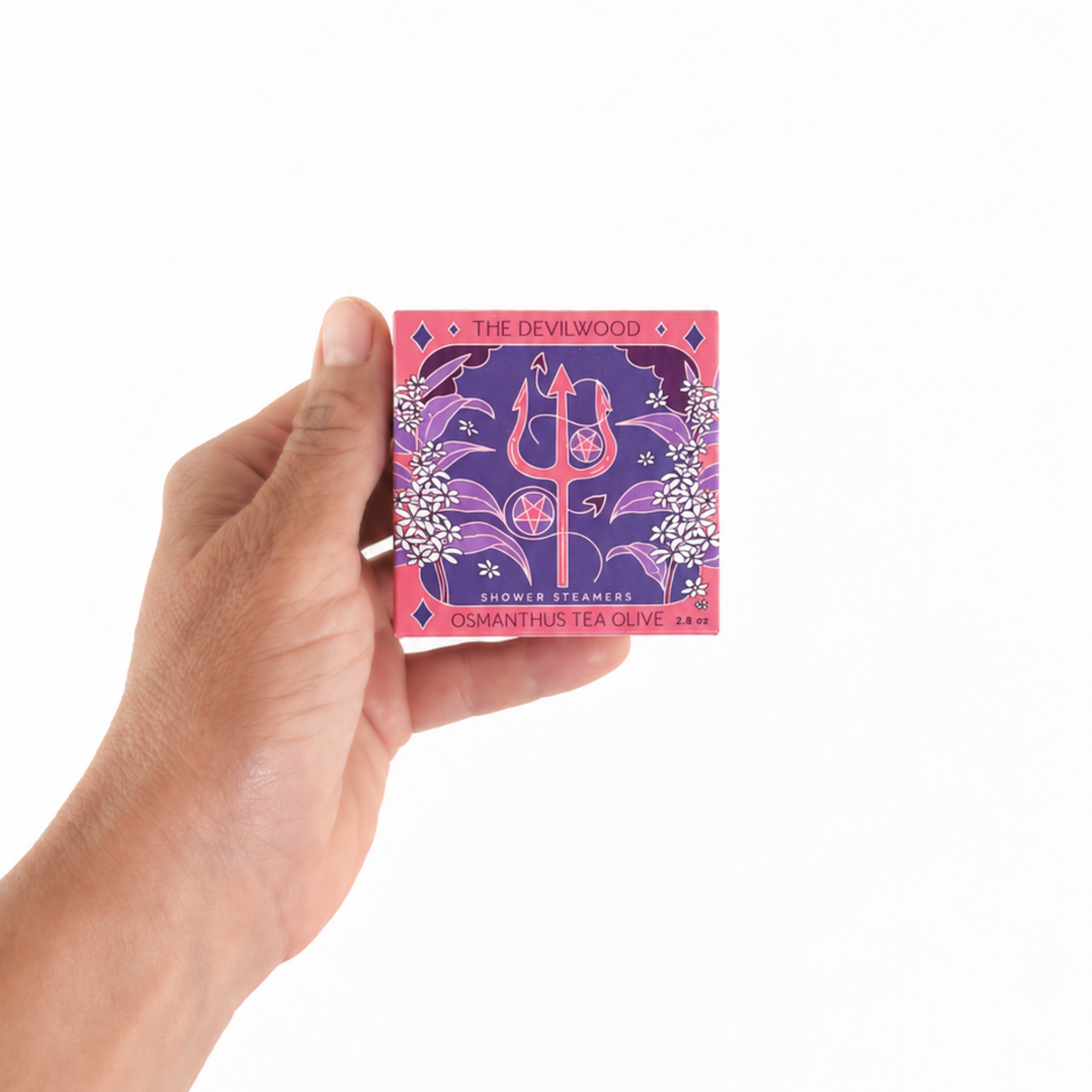 Hand holding The Devilwood Shower Steamer Set in Sweet Osmanthus to show the size of the tarot-inspired aromatherapy gift set.