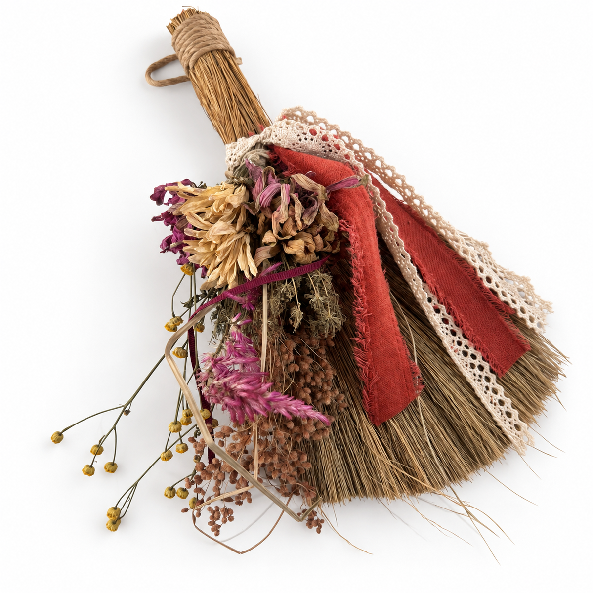Angled view of The Hearthkeeper’s Botanical Broom handcrafted with dried farm-grown flowers, textured ribbon and lace.