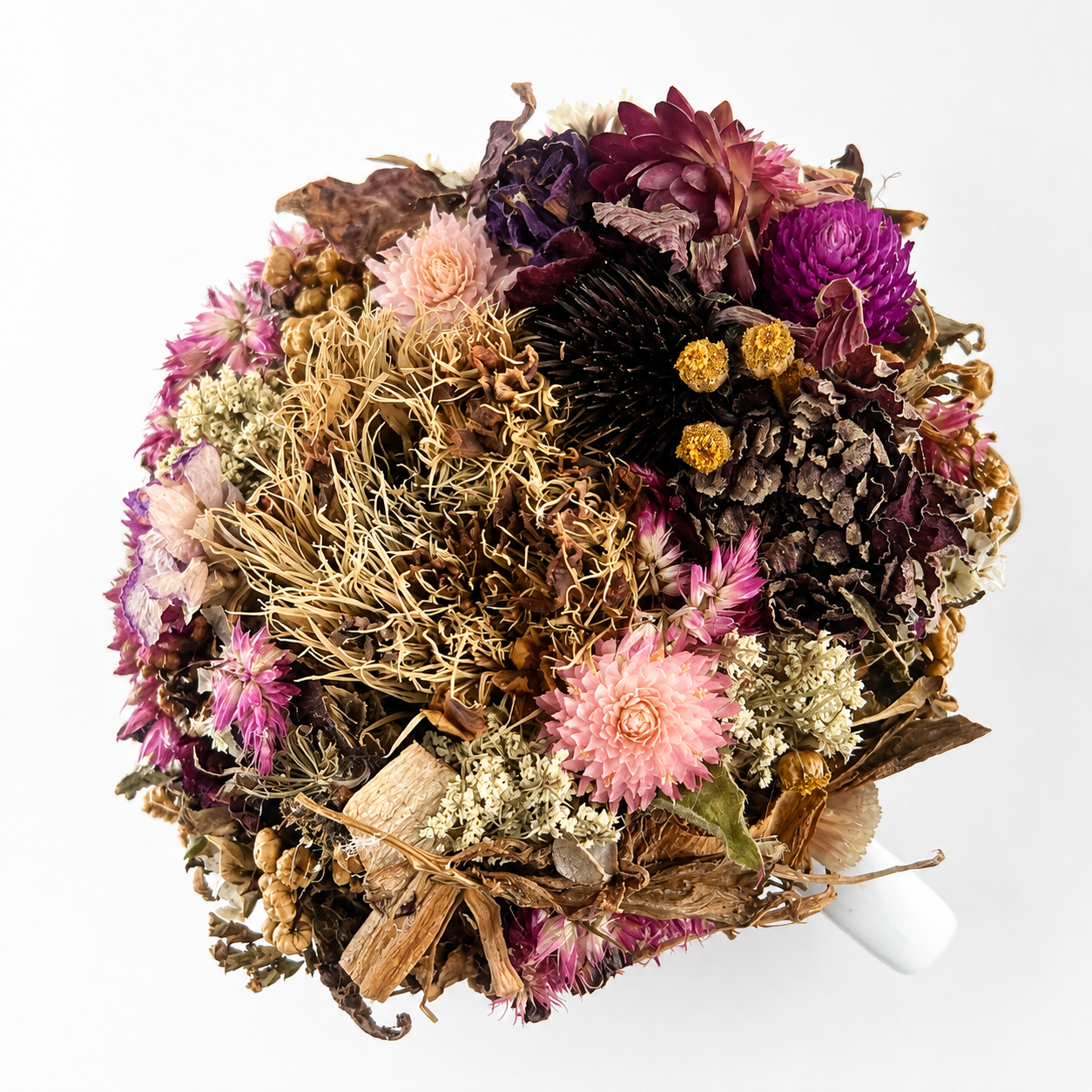 Top view of February birth flower arrangement with dried pink, burgundy, cream and natural farm-grown botanicals