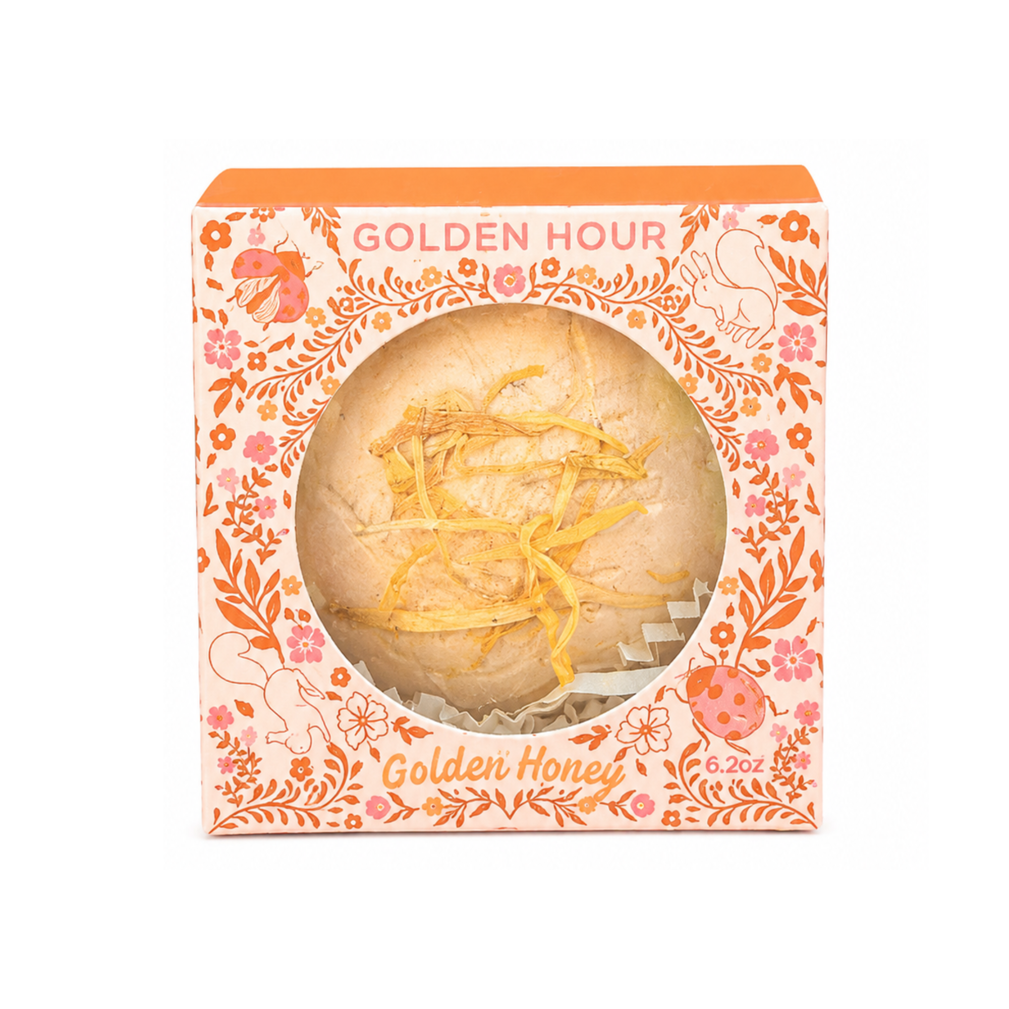 Golden Hour Golden Honey handcrafted botanical bath bomb topped with dried calendula petals in an illustrated storybook gift box by Sow the Magic.