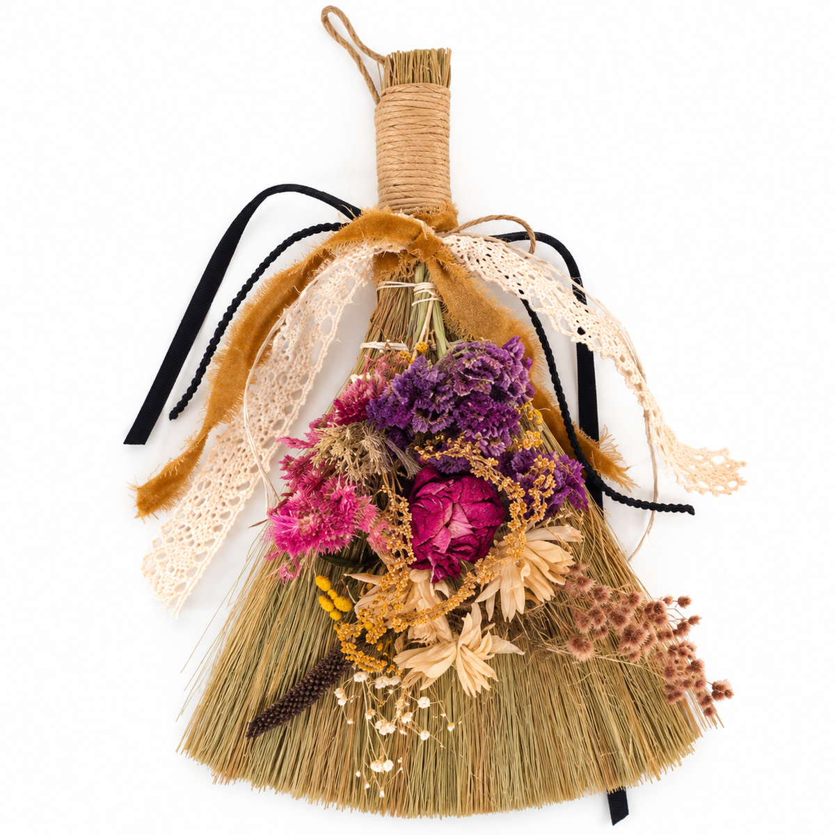 Front view of a handcrafted botanical witch broom featuring colorful dried flowers, natural straw bristles, vintage lace, and velvet ribbon accents.