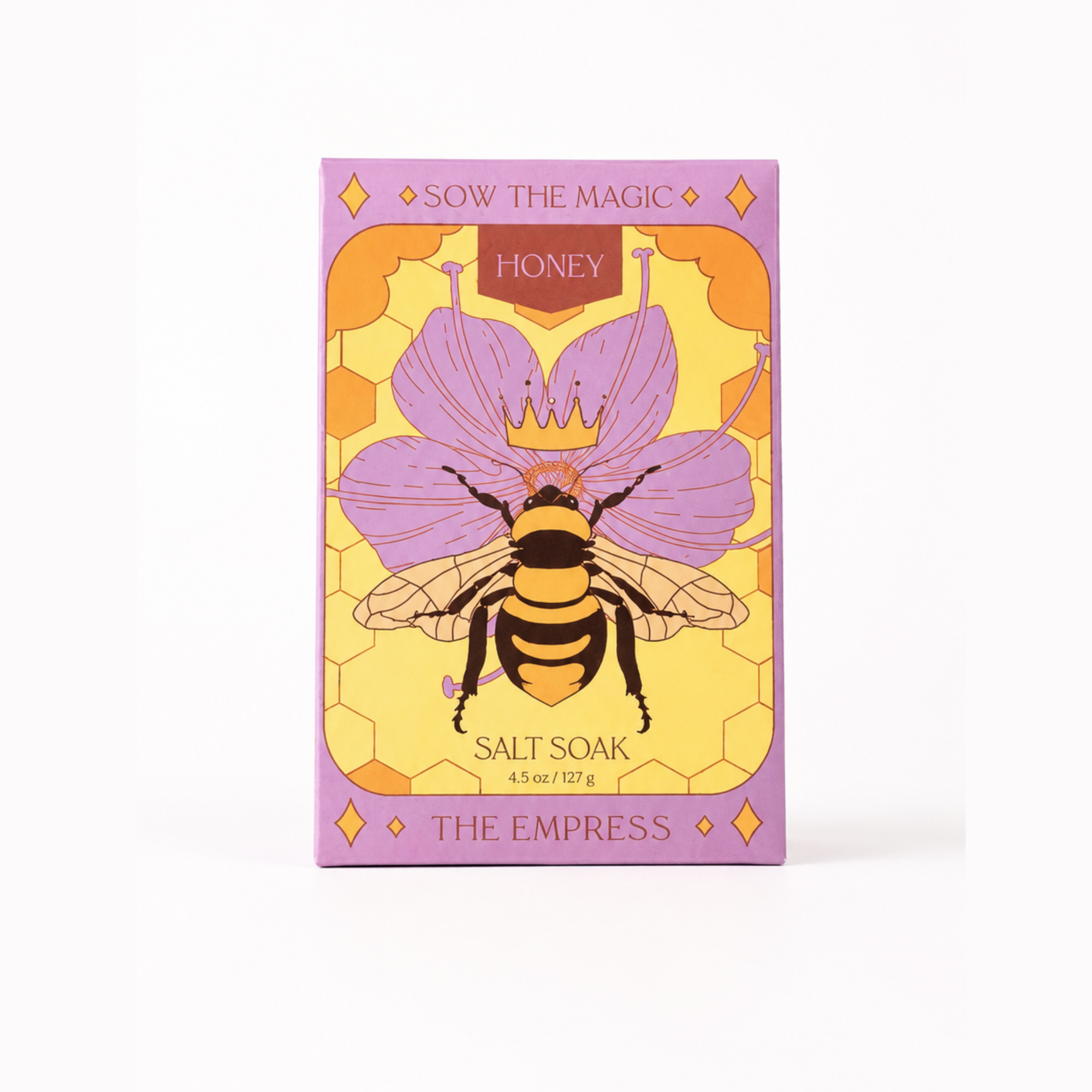 Front view of Sow the Magic® Honey Salt Soak – The Empress botanical bath salts featuring Himalayan pink salt and Epsom salt in illustrated gift box packaging with honeybee and floral artwork on a white background.