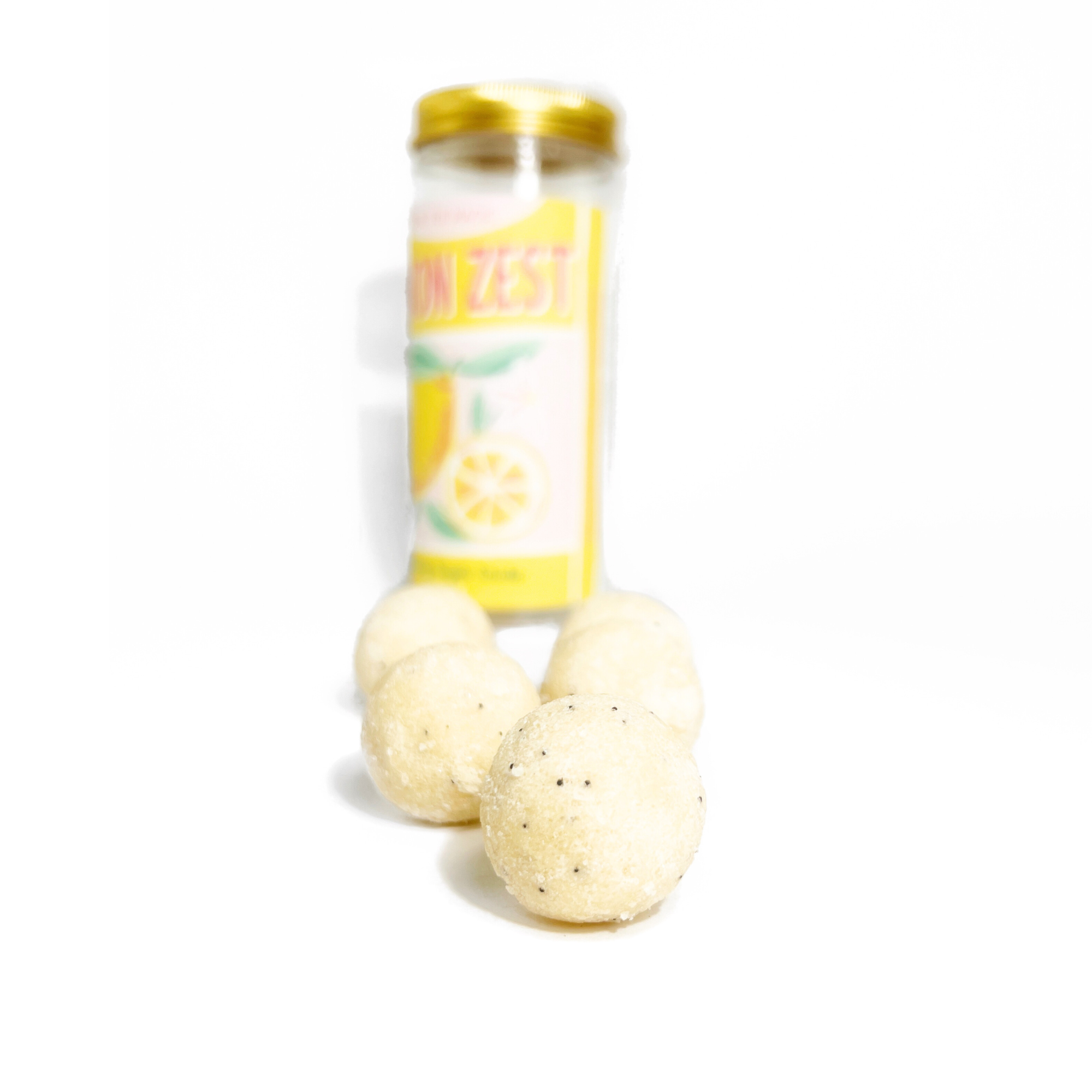 Close-up of Lemon Zest sugar scrub cubes showing the natural exfoliating texture and moisturizing ingredients for smooth, refreshed skin.