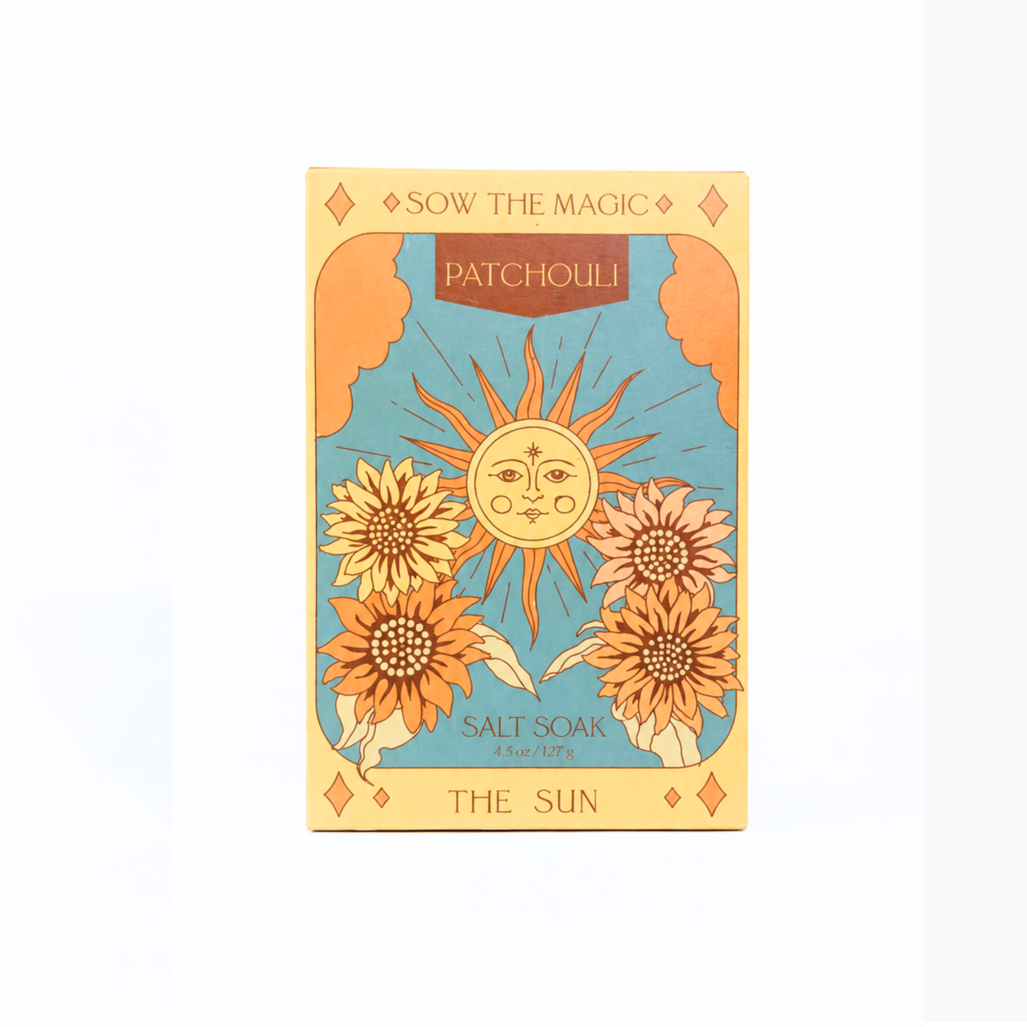 Front product photo of Sow the Magic® Patchouli Salt Soak – The Sun tarot-inspired botanical bath salts in decorative gift packaging on a bright white background, featuring sunflower artwork for relaxation, self-care and aromatherapy.