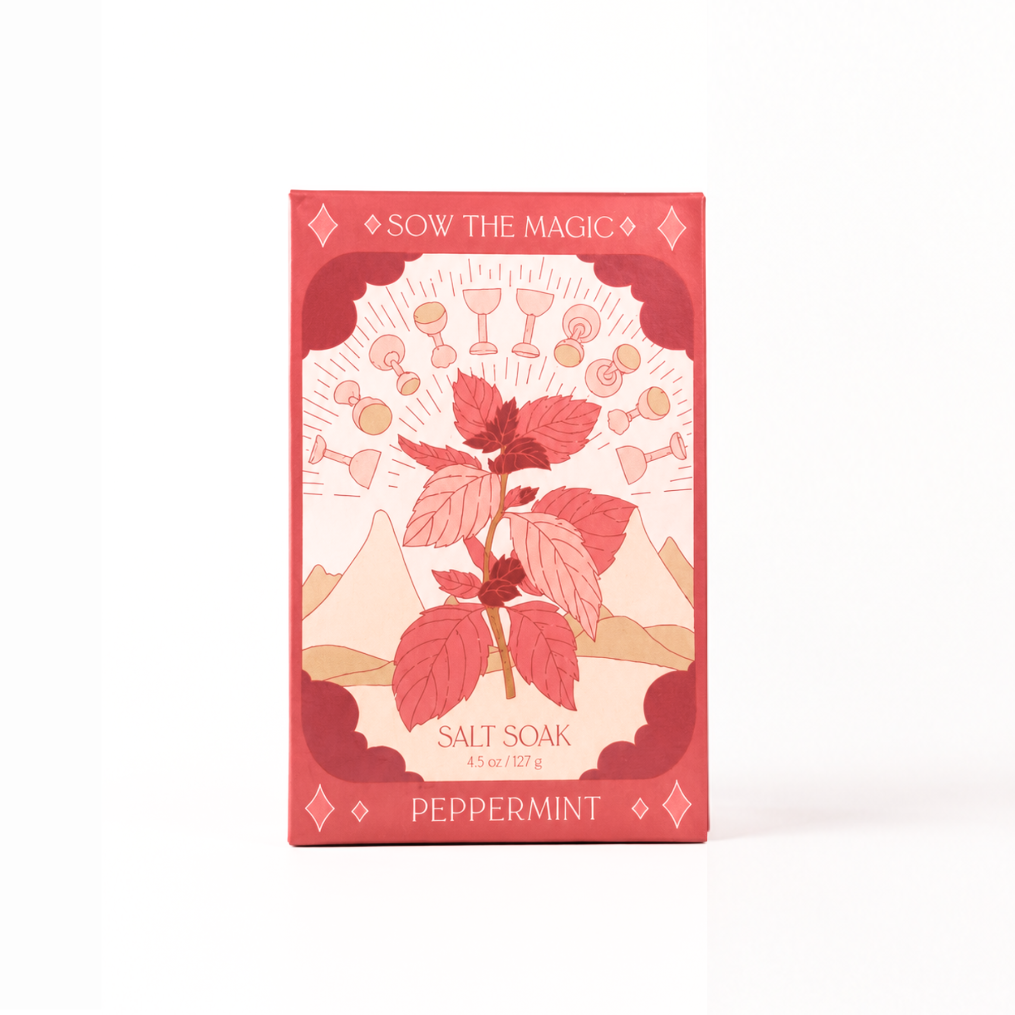 Front view of Sow the Magic® Peppermint Salt Soak featuring mineral-rich Epsom salt and Himalayan pink salt in botanical gift box packaging with peppermint leaf artwork on a white background.
