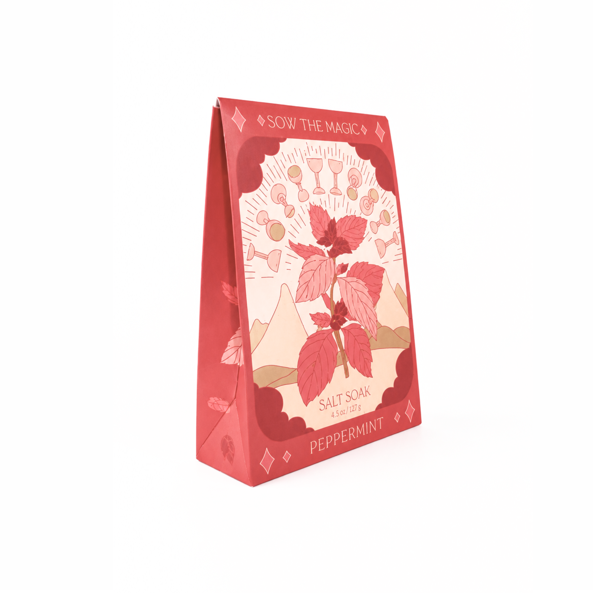 Side view of Sow the Magic® Peppermint Salt Soak featuring mineral-rich Epsom salt and Himalayan pink salt in botanical gift box packaging with peppermint leaf artwork on a white background.
