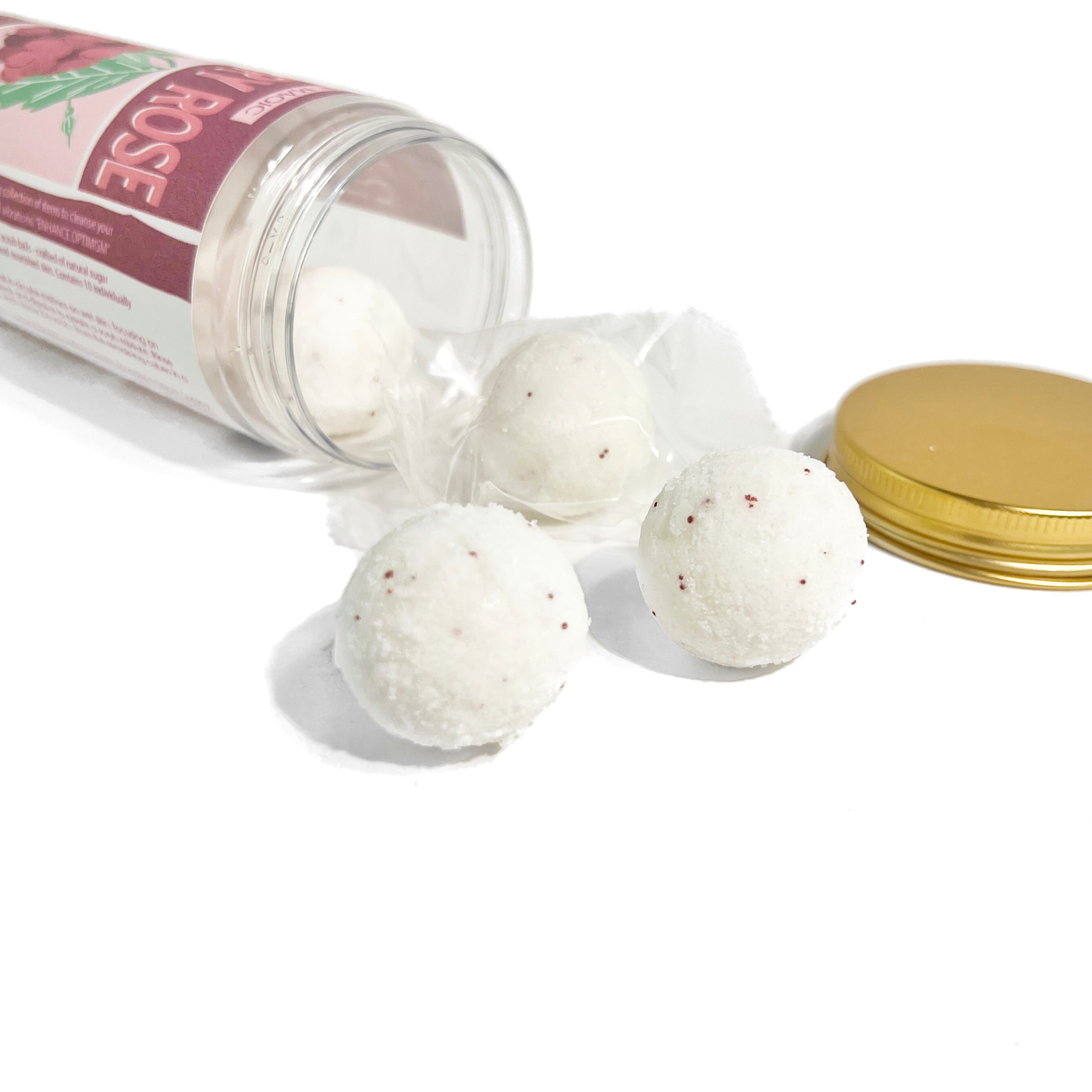 Close-up of individually wrapped Raspberry Rose sugar scrub cubes spilling from the jar, highlighting the natural exfoliating texture and spa-inspired skincare.