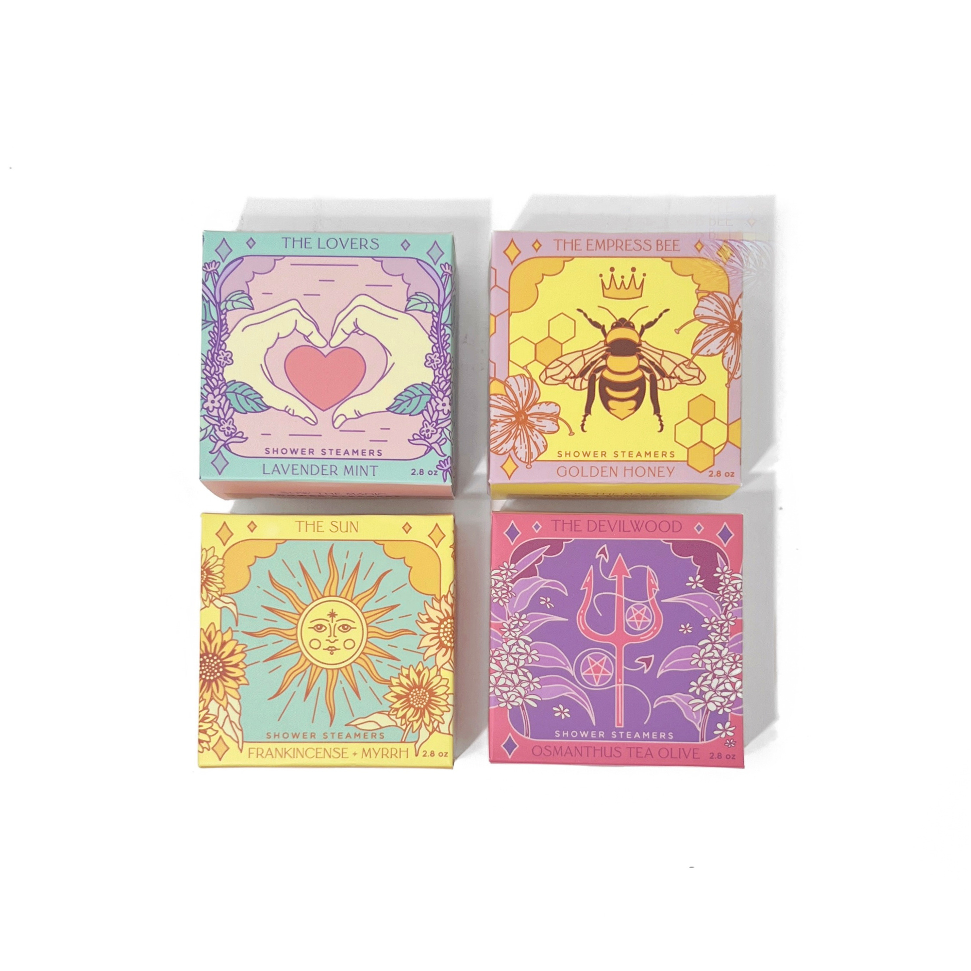Collection of botanical tarot shower steamer gift sets arranged together to showcase multiple fragrances.