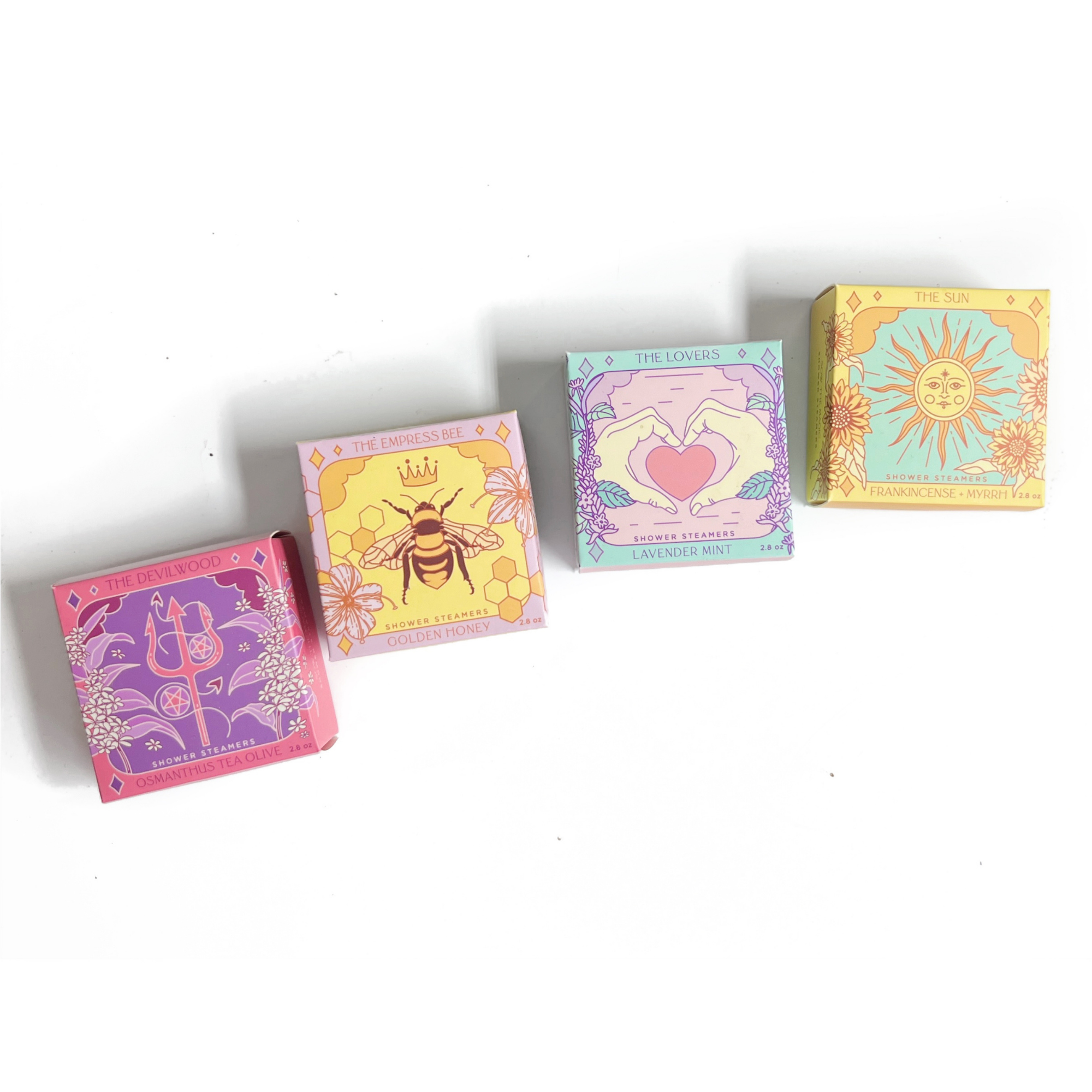 Complete Tarot Shower Steamer Collection by Sow the Magic® featuring The Devilwood, The Empress Bee, The Lovers, and The Sun botanical aromatherapy shower steamer gift sets.