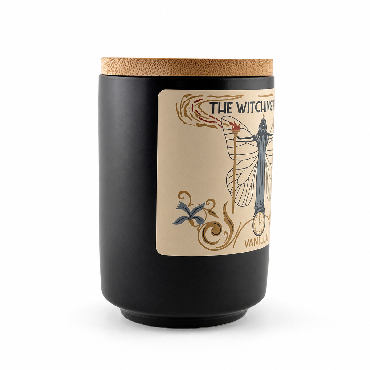Angled view of The Witching Hour Vanilla candle showing the matte black jar, bamboo lid and cream label