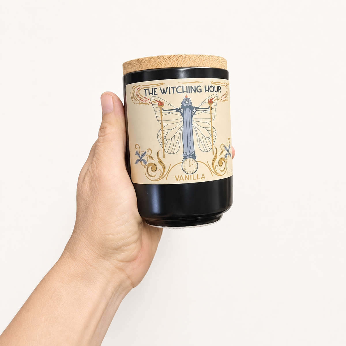 The Witching Hour vanilla candle in a black jar with a natural cork lid and vintage-inspired mystical label