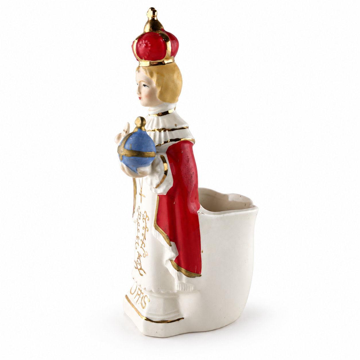 Side and back view of vintage Infant of Prague porcelain figurine showing red mantle, gold trim and open back