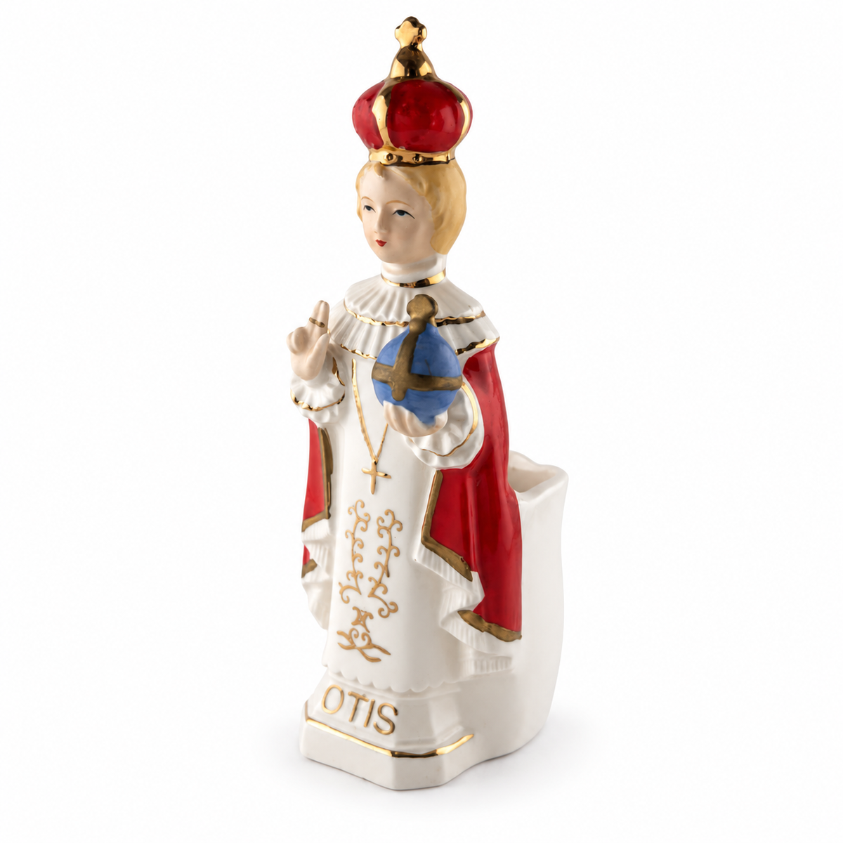 Angled view of vintage Lefton China Infant of Prague figurine with hand-painted red, blue and gold details