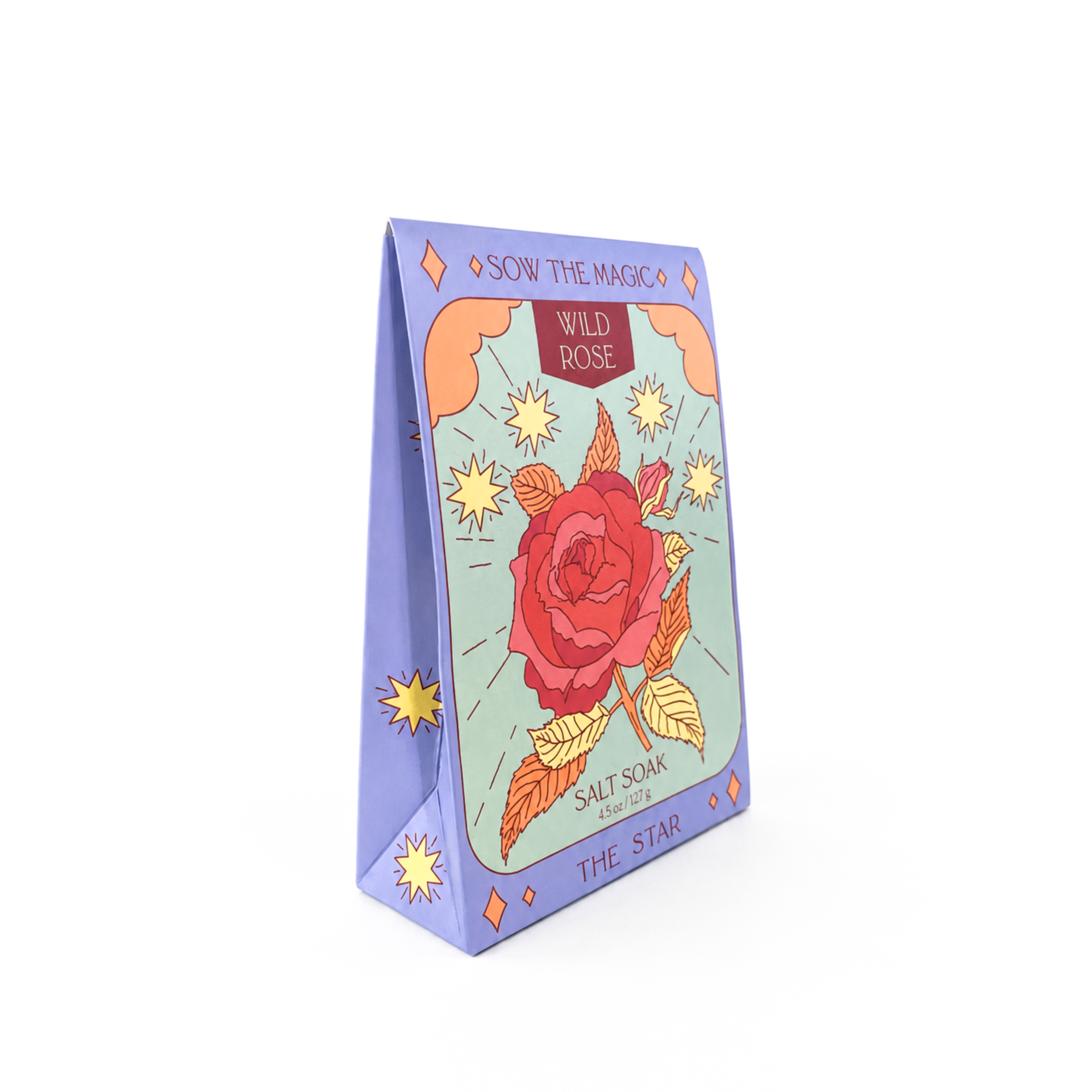 Wild Rose botanical salt soak by Sow the Magic displayed on a bright white background. This tarot-inspired bath soak features Himalayan pink salt and Epsom salt infused with wild rose, packaged in illustrated eco-friendly gift-ready packaging inspired by The Star tarot card.