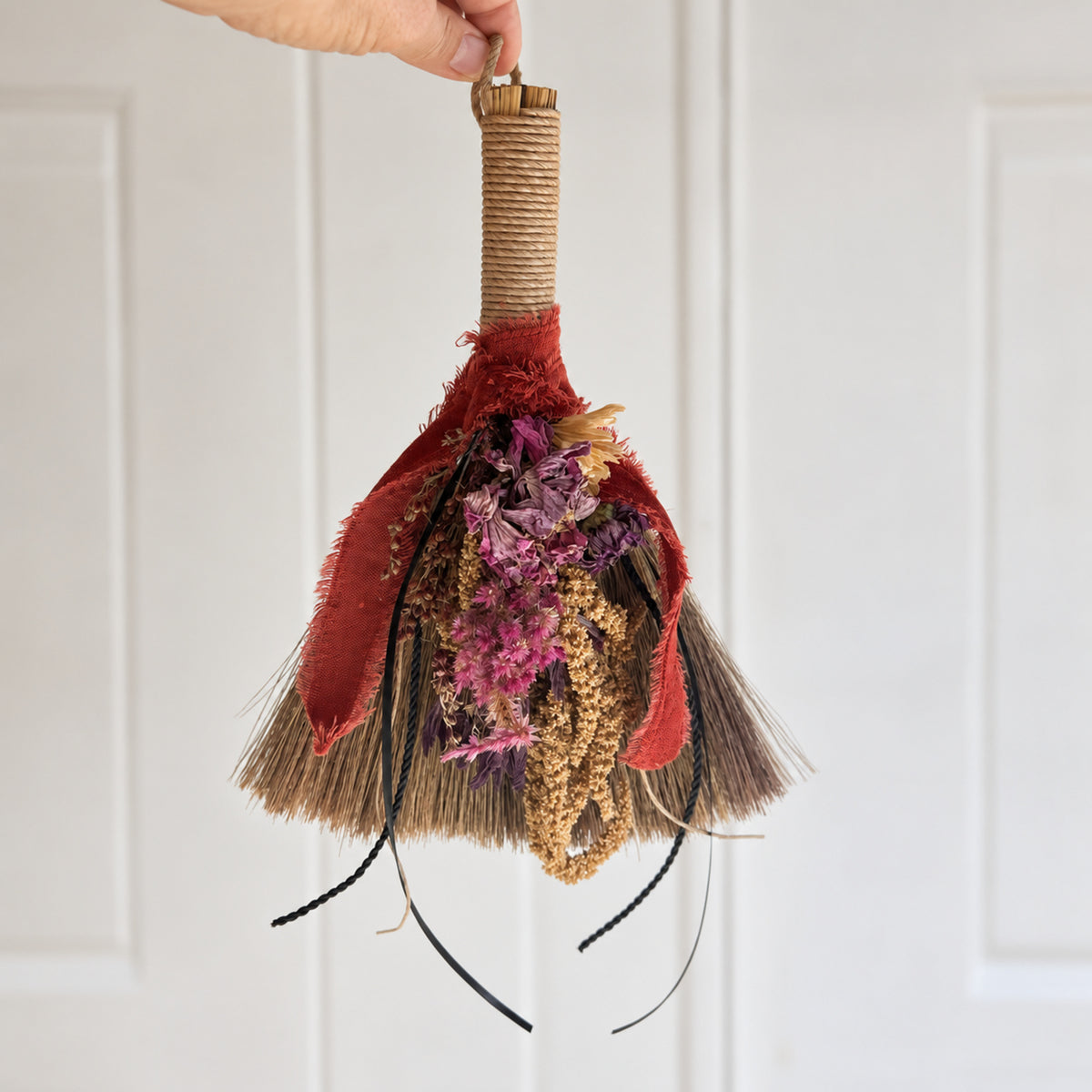 Wildheart Botanical Broom hanging indoors as botanical, cottage-inspired and witchy home decor