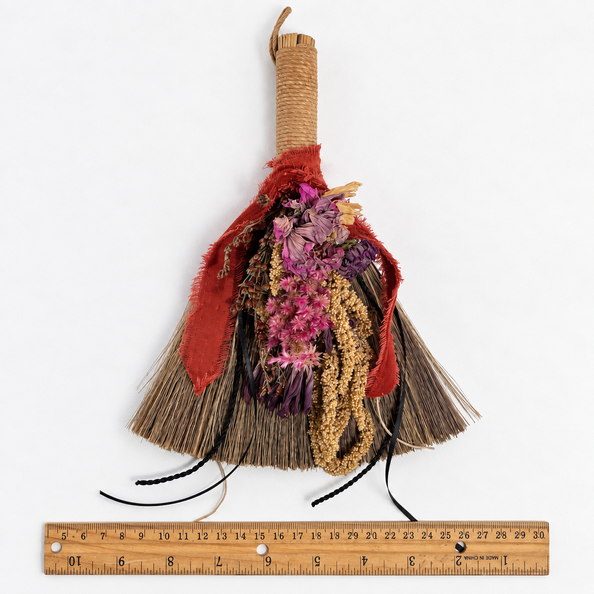 Wildheart Botanical Broom shown with a ruler to demonstrate the approximate width of the handmade botanical broom