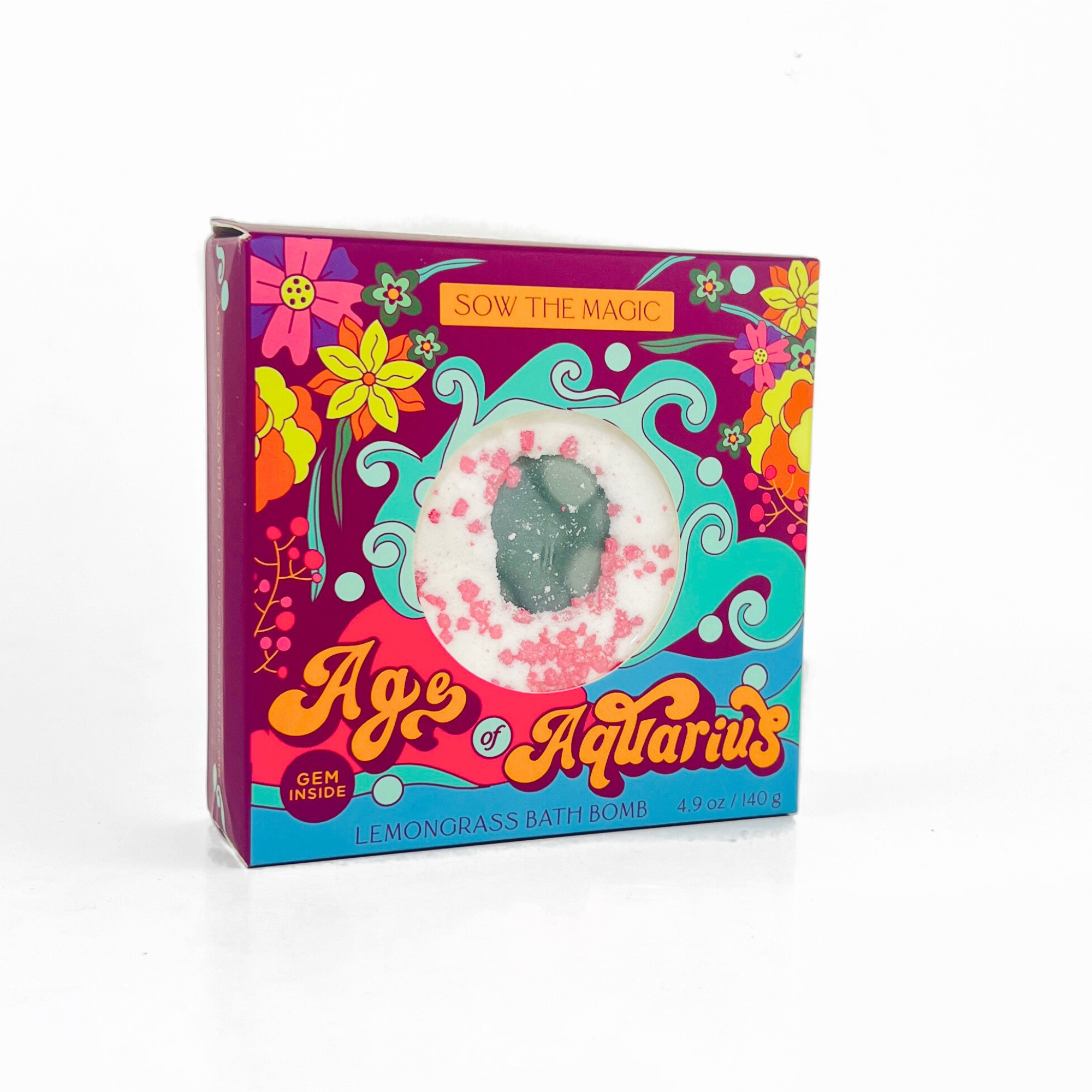 Single Age of Aquarius Lemongrass Bath Bomb in box on white background showing floral packaging design