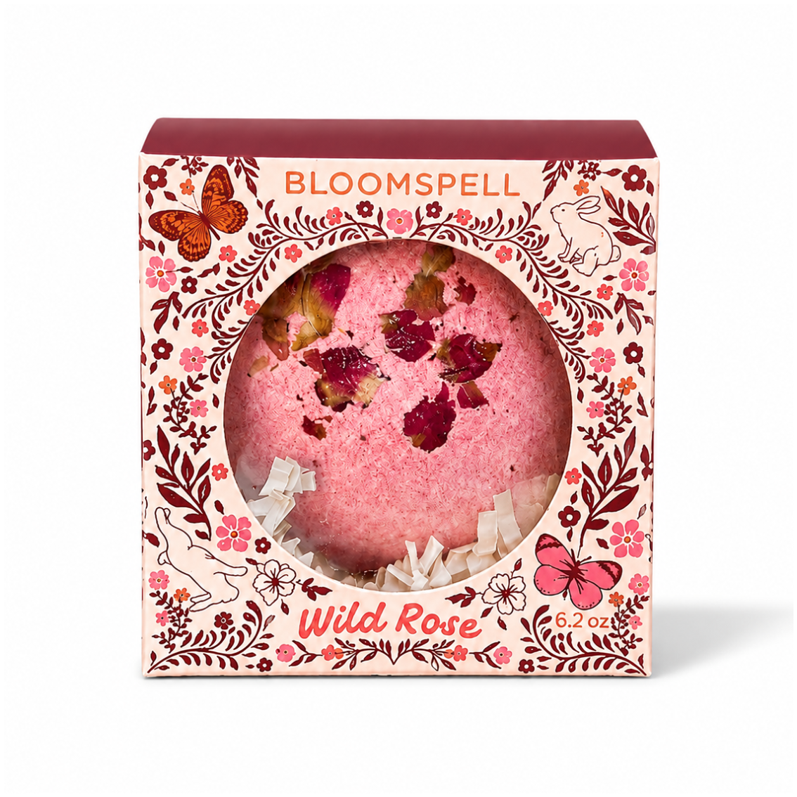 Bloomspell Wild Rose bath bomb gift box with botanical floral packaging and pink rose petal bath bomb displayed on a clean white background with a soft shadow.