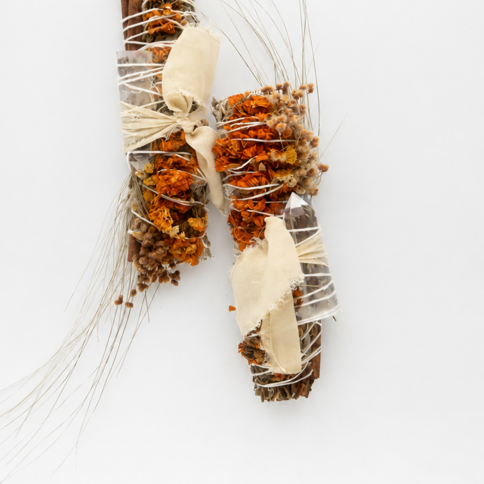 Handcrafted botanical smoke cleansing wands decorated with dried flowers, herbs and natural twine
