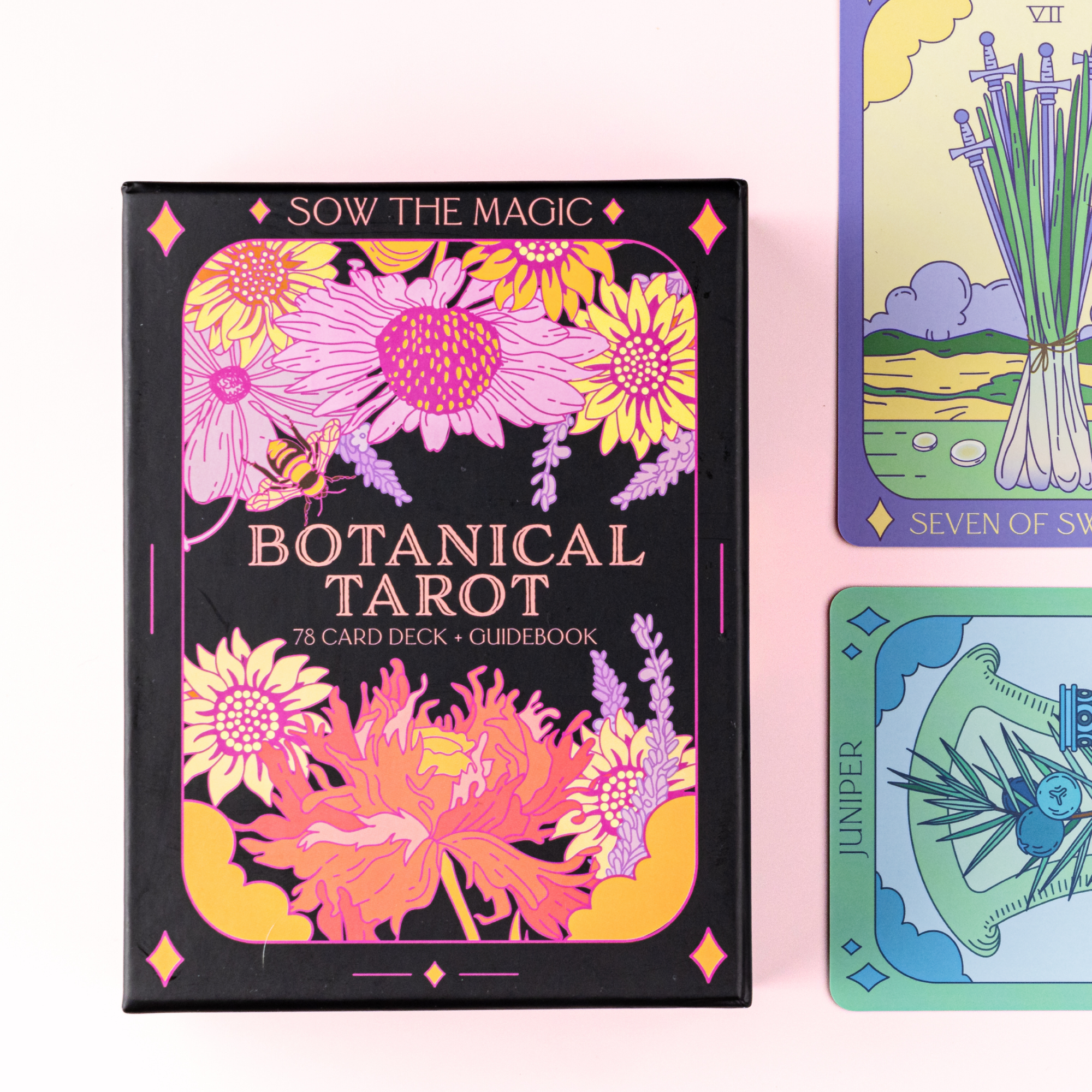 Botanical Tarot Deck and Guidebook box featuring bright floral artwork and Sow the Magic branding in black and pink design.