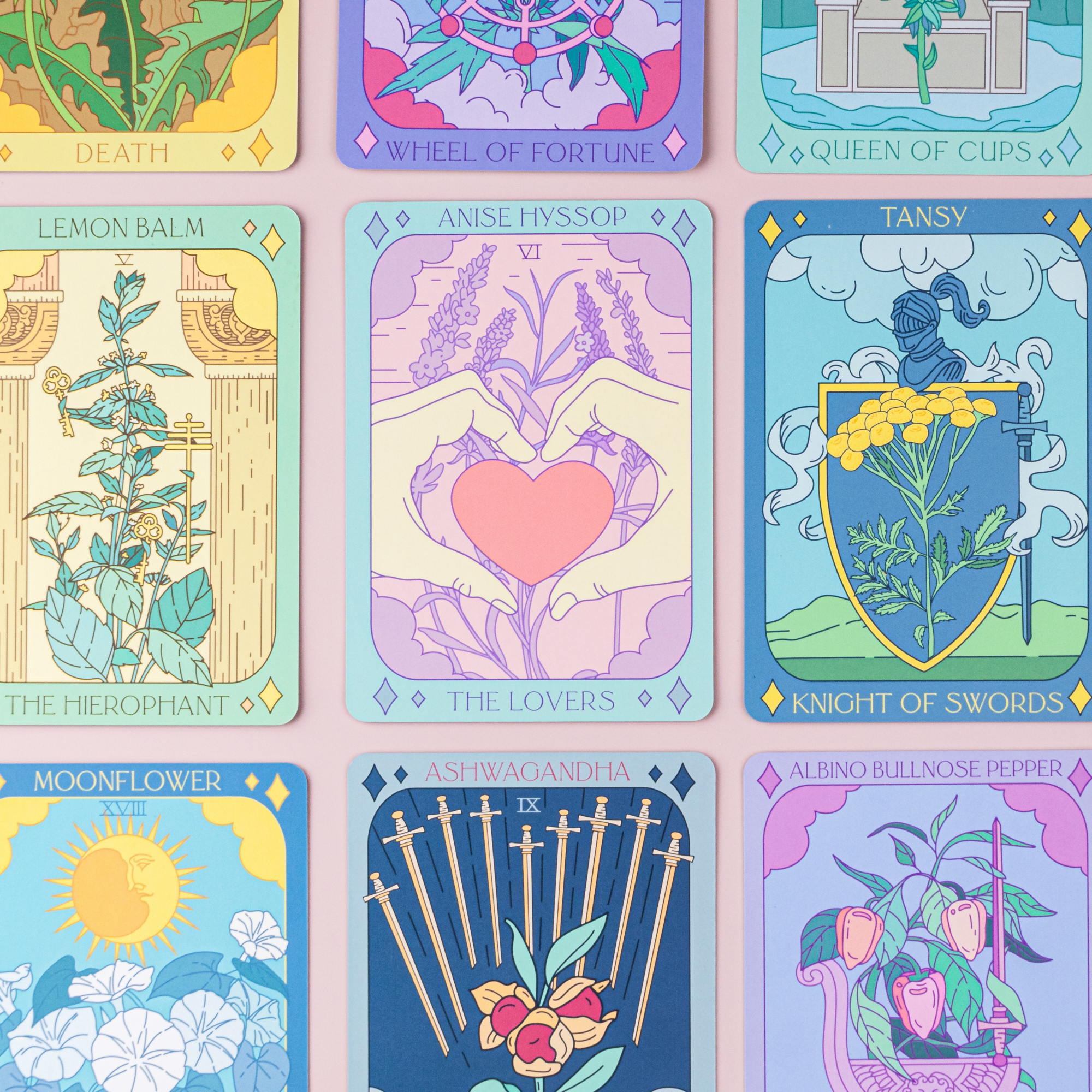 Botanical Tarot Deck cards displayed flat with vibrant plant-inspired illustrations including Lemon Balm, Anise Hyssop, and Moonflower.