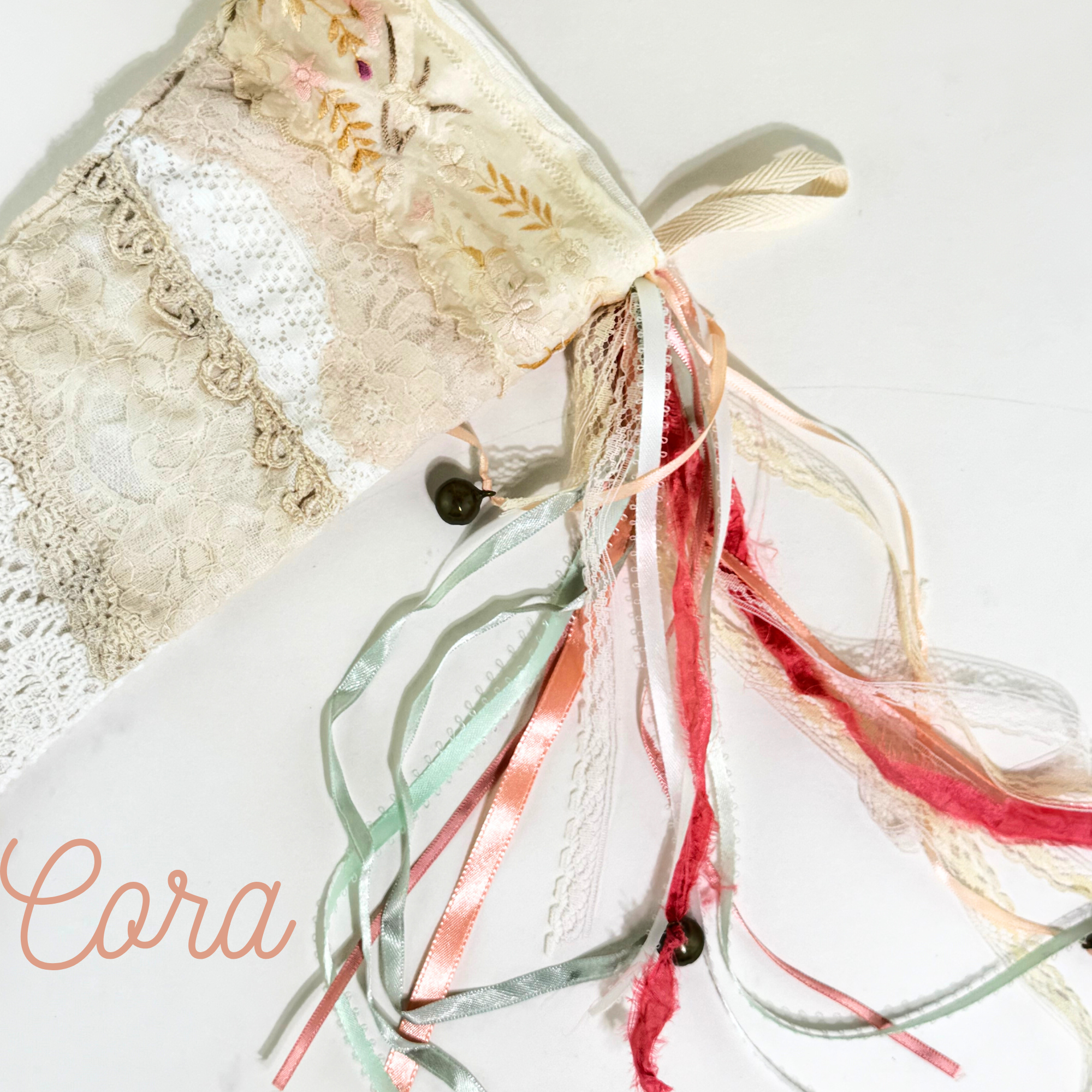 Satin and lace ribbon tassels on vintage-inspired Cora lace Christmas stocking handmade in soft neutrals