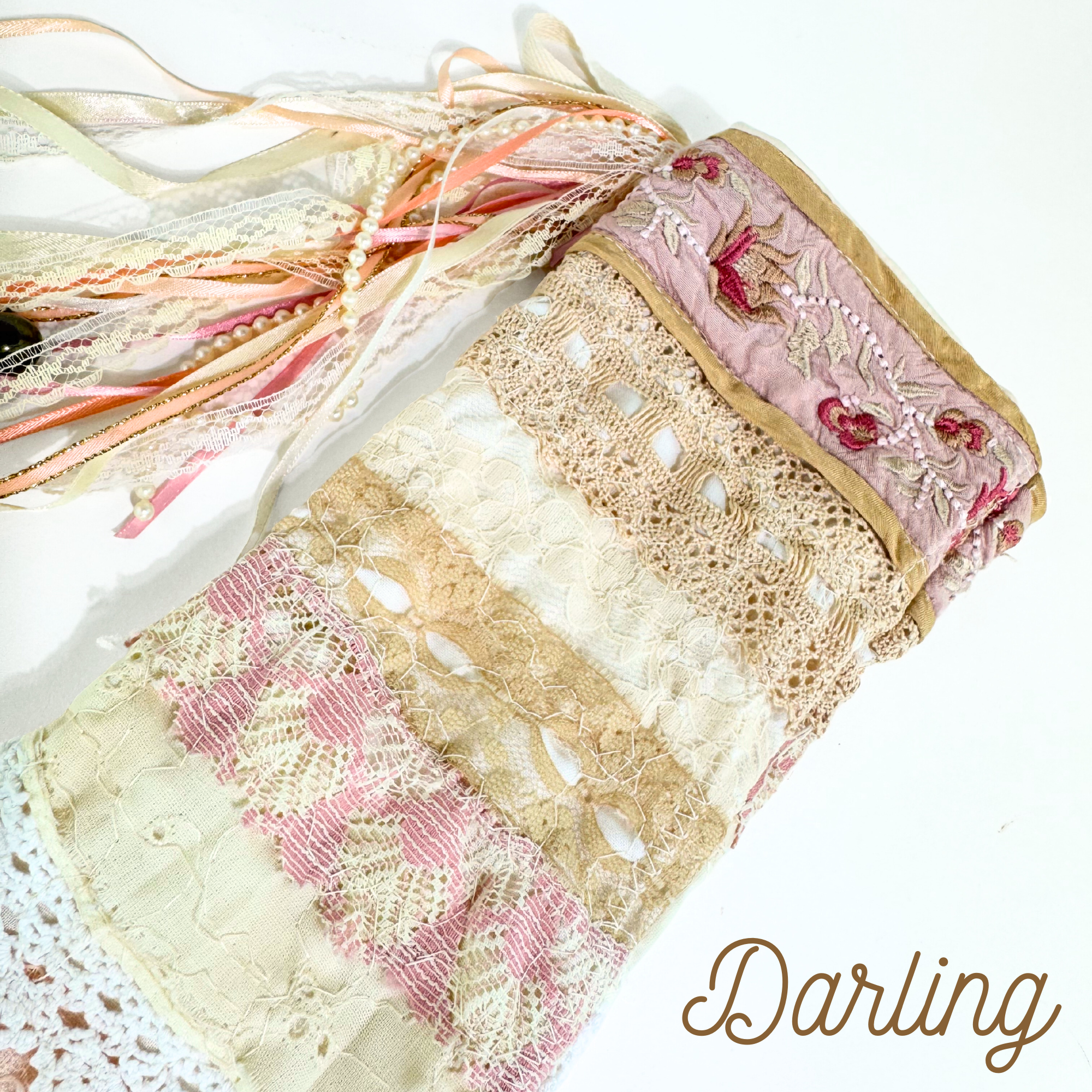 Handmade lace Christmas stocking top with embroidered floral trim, tan lace, and peach ribbon accents