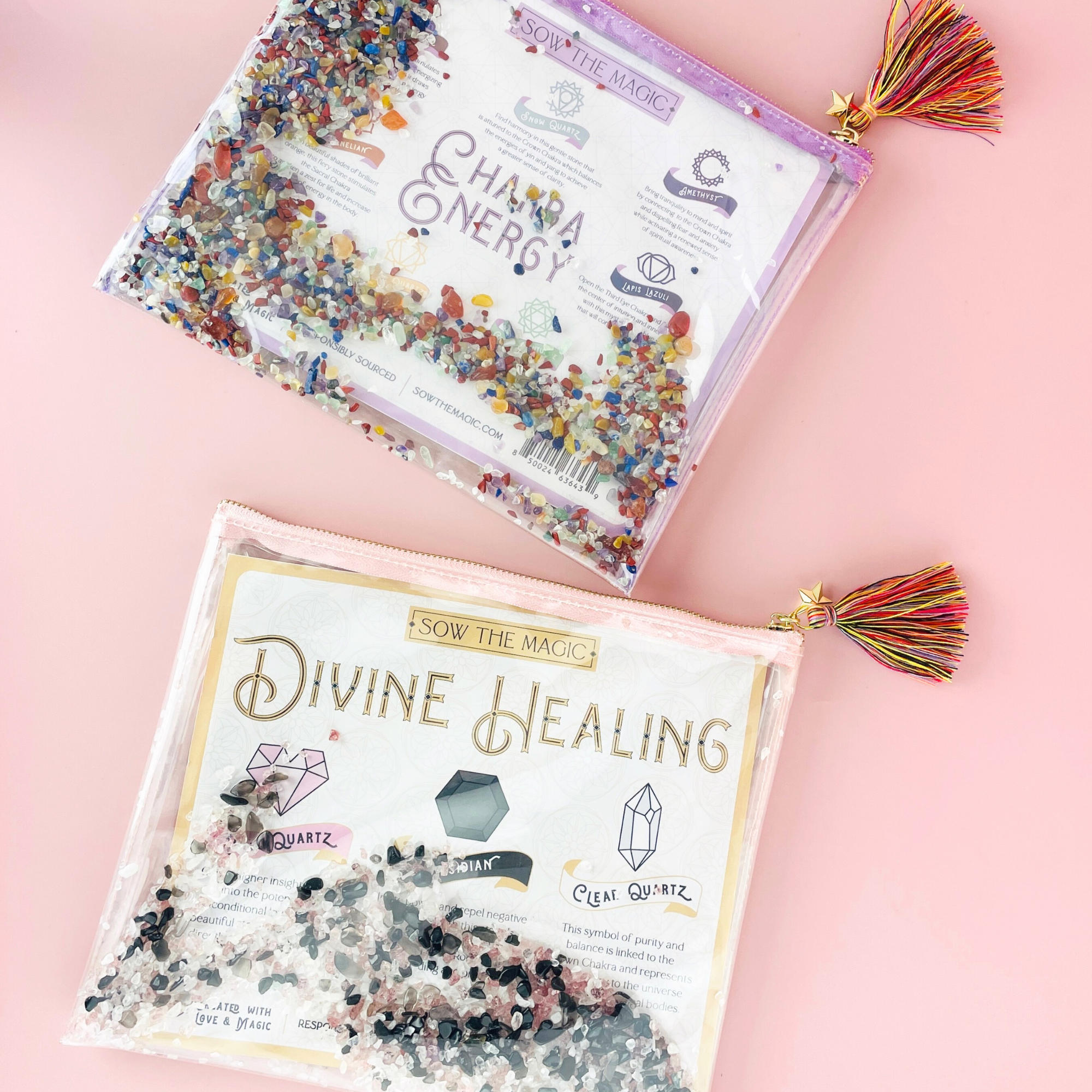Flatlay of Divine Healing and Chakra Energy Gemstone Cosmetic Bags with tassels and colorful healing crystals on pink background
