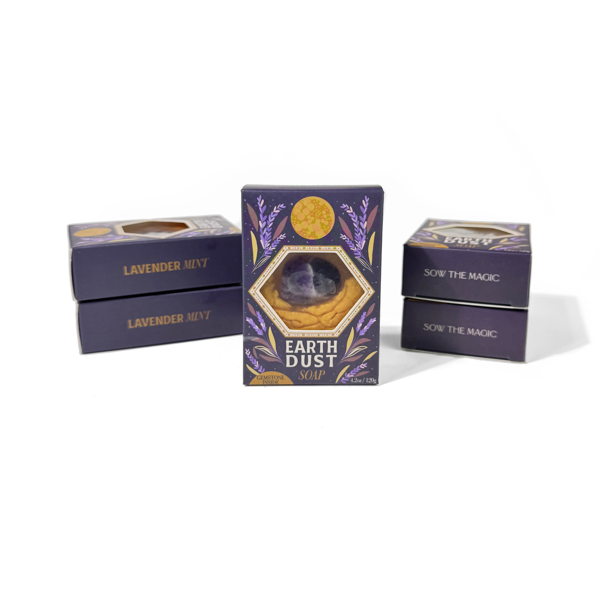 Earth Dust Gemstone Bar Soap front packaging featuring lavender and gold design with visible amethyst gemstone inside.