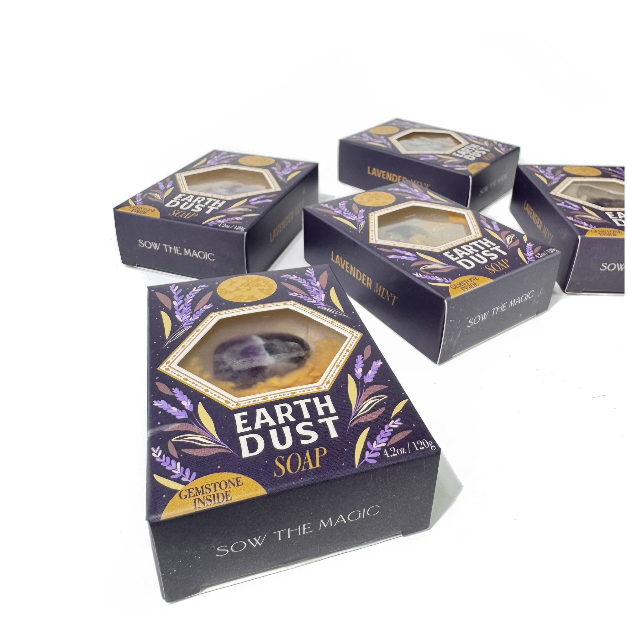 Earth Dust Gemstone Soaps stacked with side labels reading Lavender Mint and Sow the Magic branding visible.