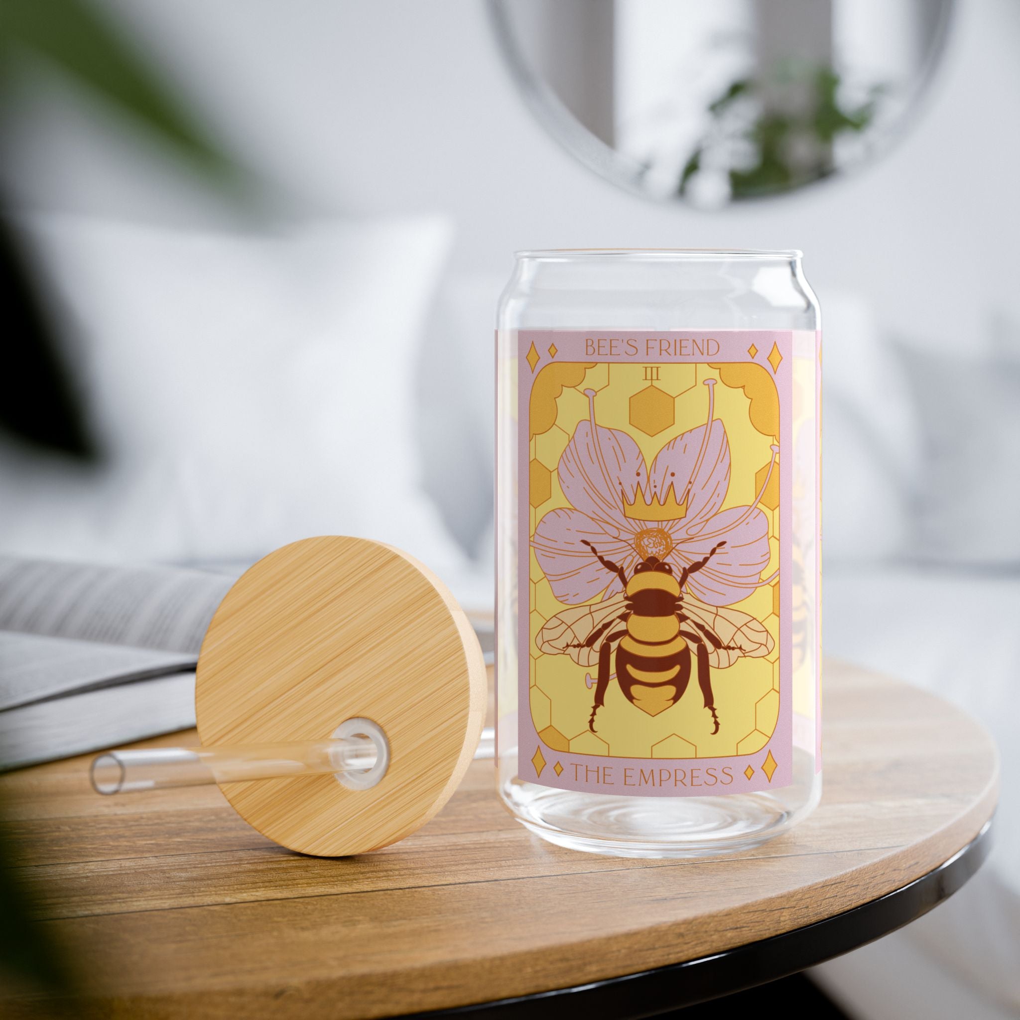 Sow The Magic Empress Bee tarot glass tumbler styled on a table with bamboo lid and clear straw