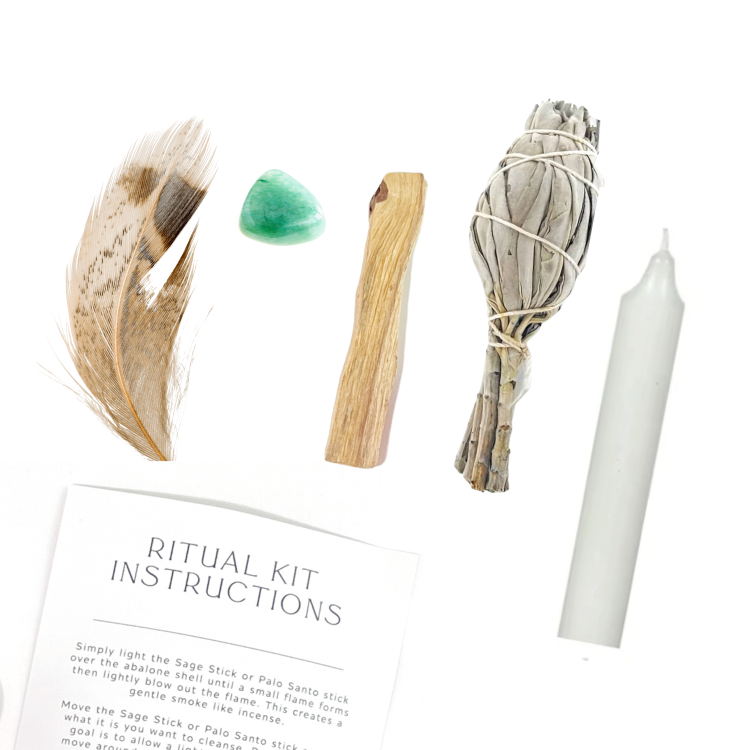lat lay of Energy Ritual Kit items including Aventurine crystal, Sage bundle, Palo Santo, feather and candle