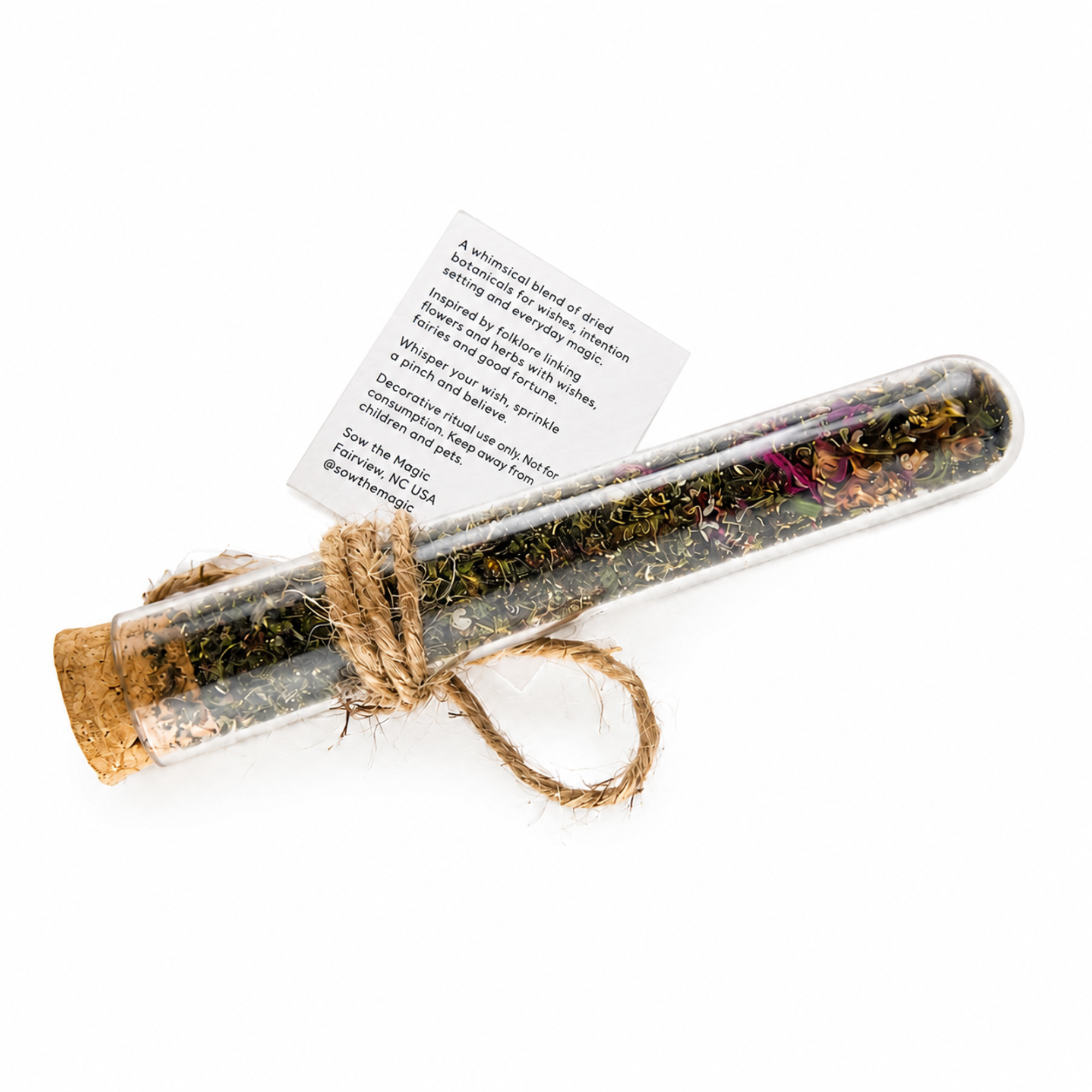 Fairy Wishing Dust botanical vial showing the product information tag and rustic jute wrapping