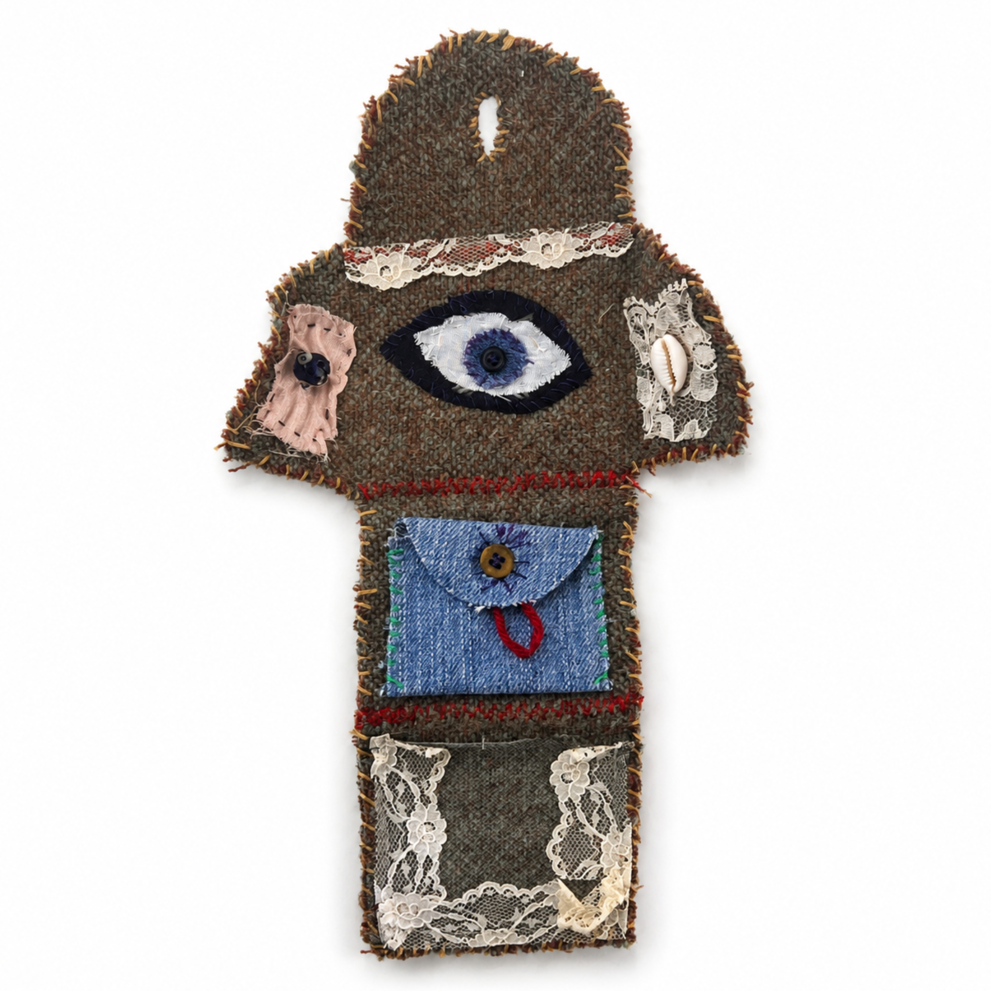 Open handmade pocket altar with evil eye, cowrie shell, denim crystal pouch and lace intention pocket