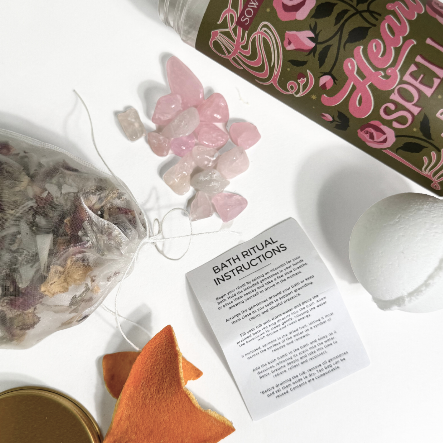 Heart Spell bath ritual kit with rose quartz crystals, bath bomb, botanicals tea bag, and ritual instructions by Sow the Magic