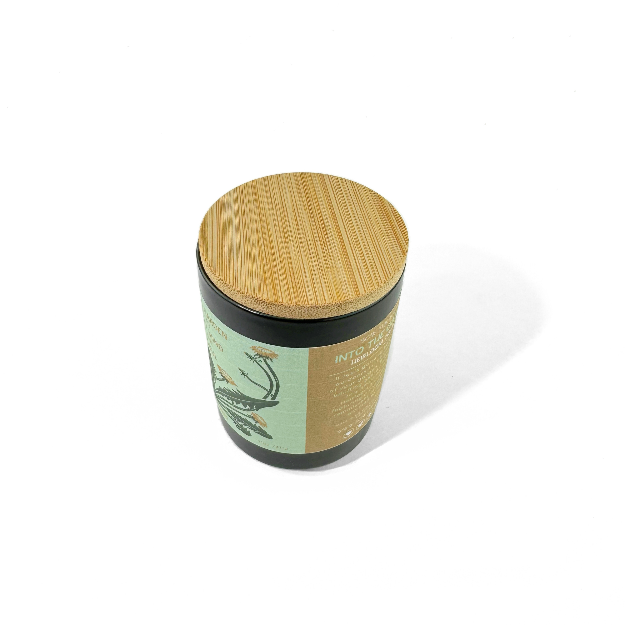 Green garden candle inspired by tomato vines and sunlight with wooden lid