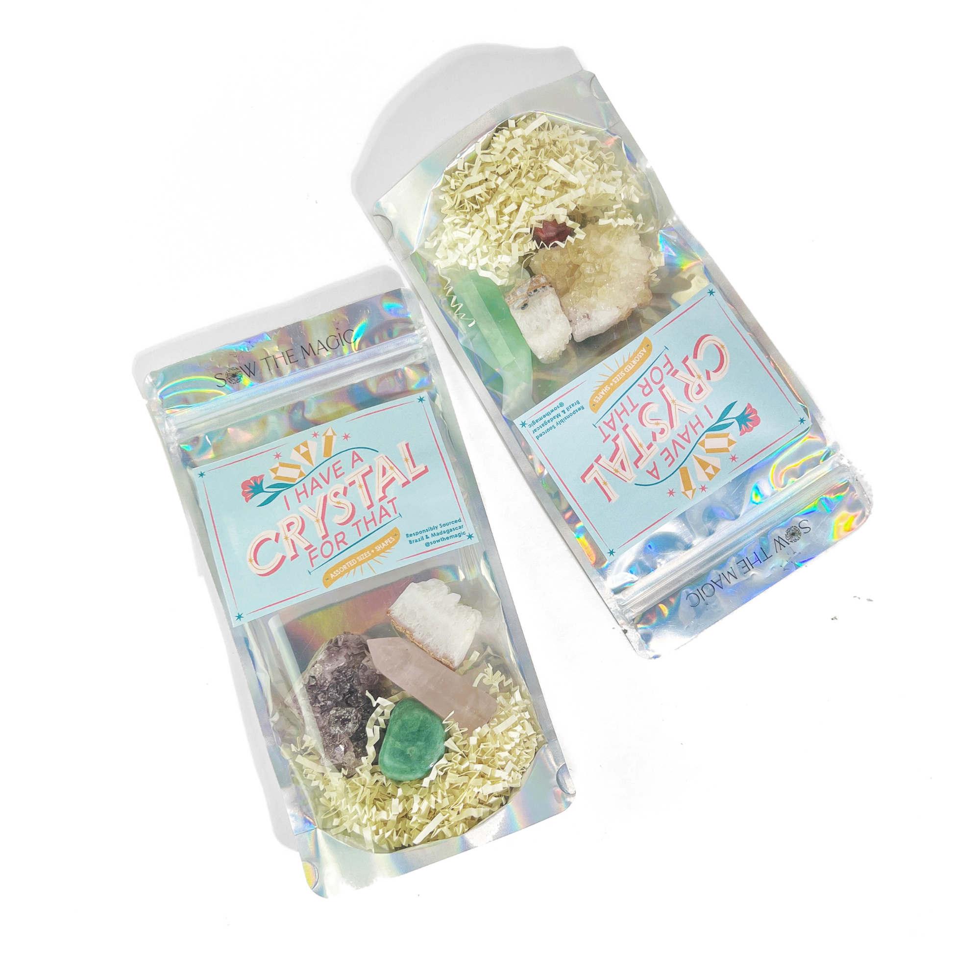 Two holographic crystal bags filled with assorted natural stones and labeled “I Have a Crystal for That”
