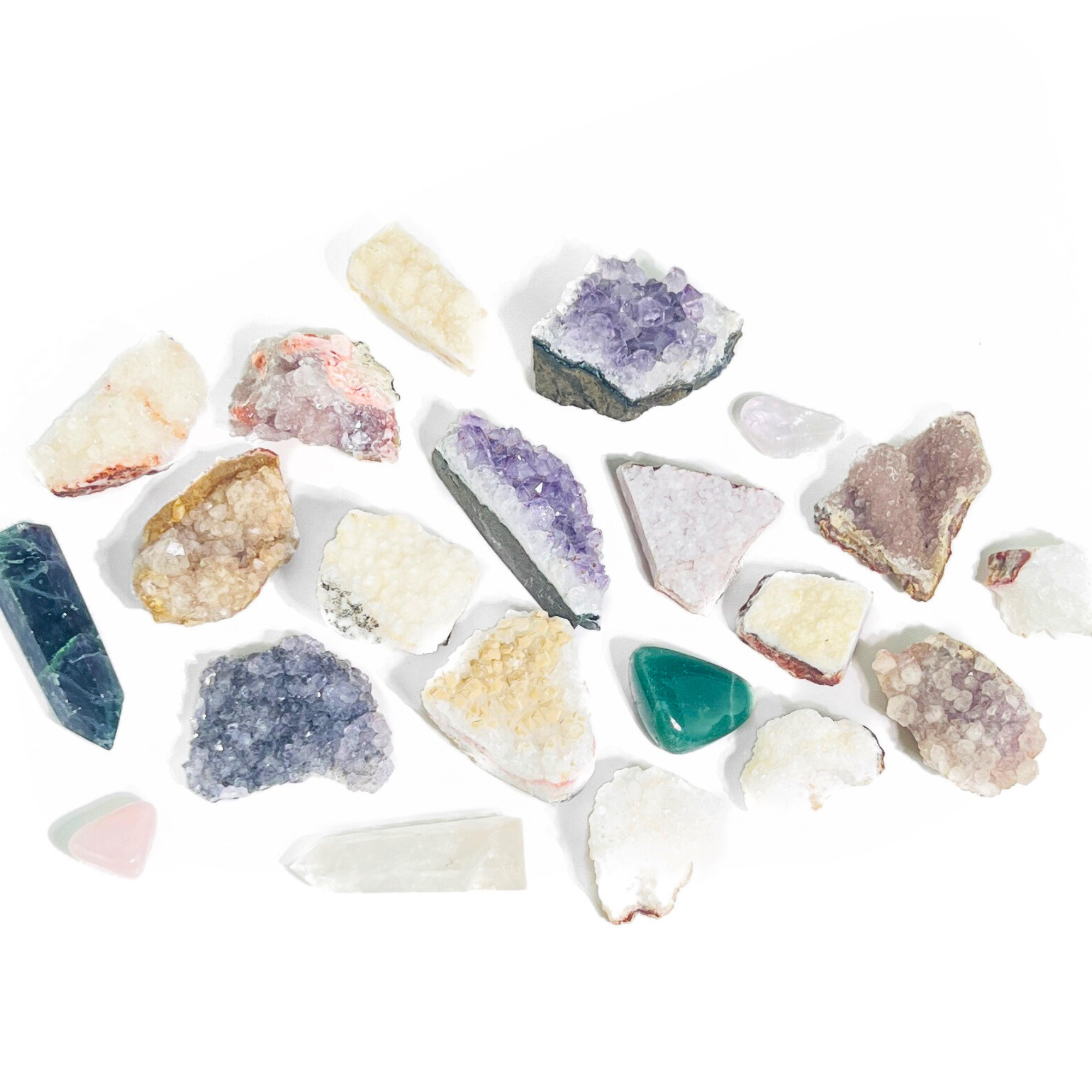 Close-up of assorted raw and polished crystals in mixed colors and shapes