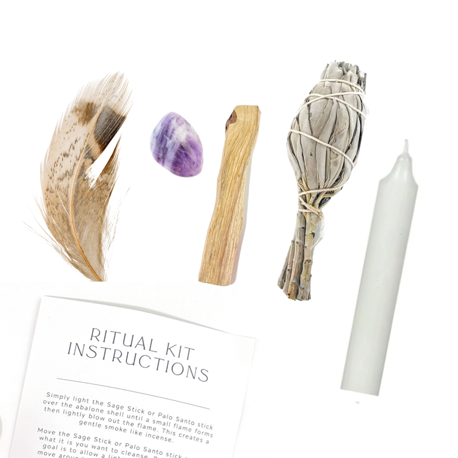 Flat lay of Intuition Ritual Kit items including Amethyst, Sage bundle, Palo Santo, feather, candle and ritual instructions