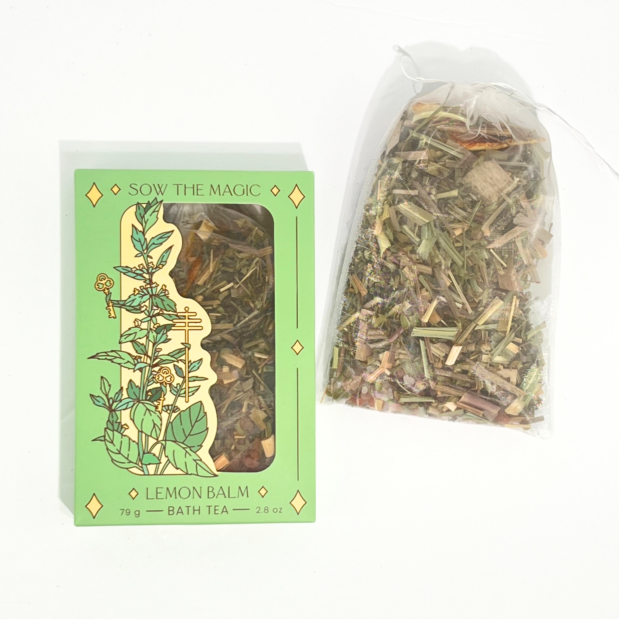 Lemon Balm Bath Tea Box and open reusable tea bag by Sow the Magic with loose herbs and botanicals on white background.