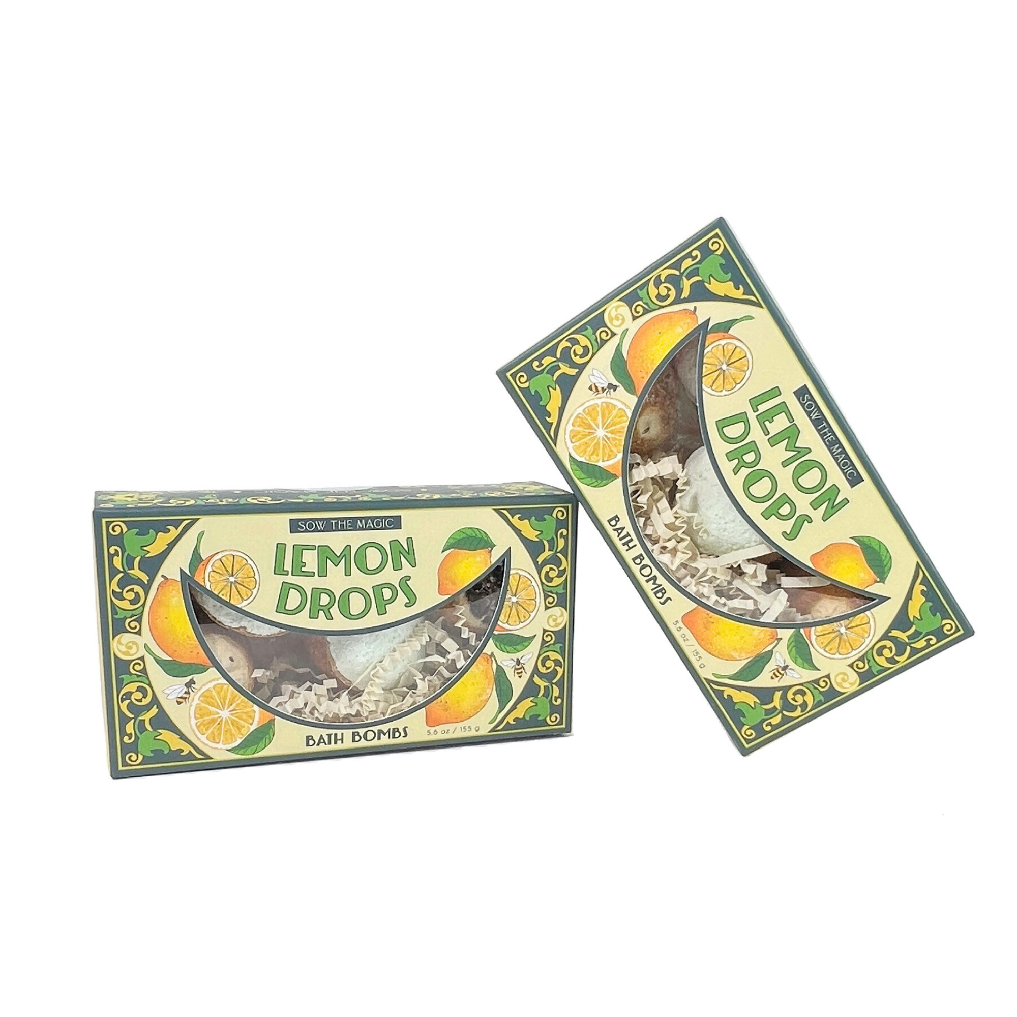 Pair of Lemon Drop Bath Bomb boxes with citrus and floral artwork inspired by lemons and greenery