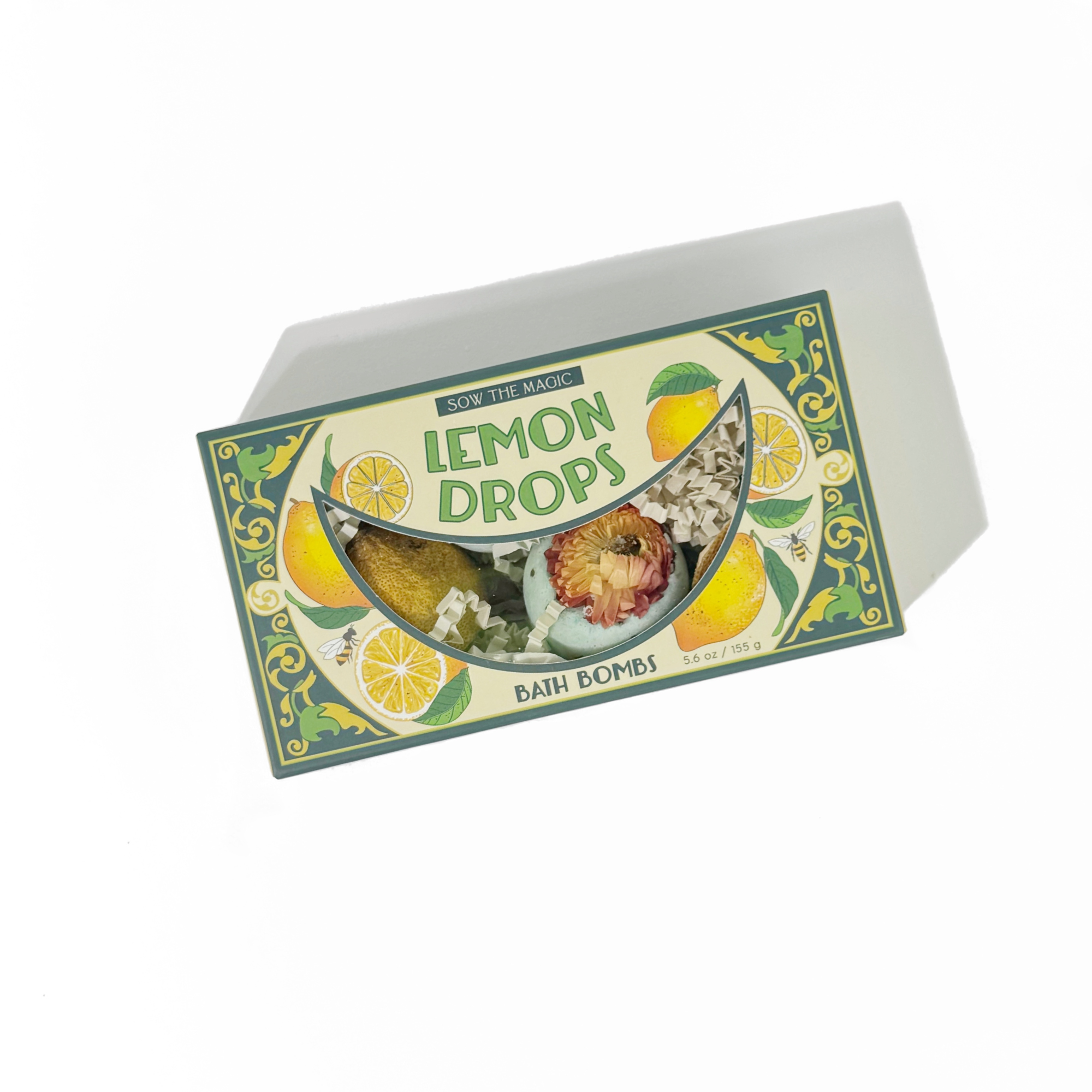 Lemon Drop Bath Bomb Gift Set flat display showing open box with lemon-inspired botanical bath bombs inside