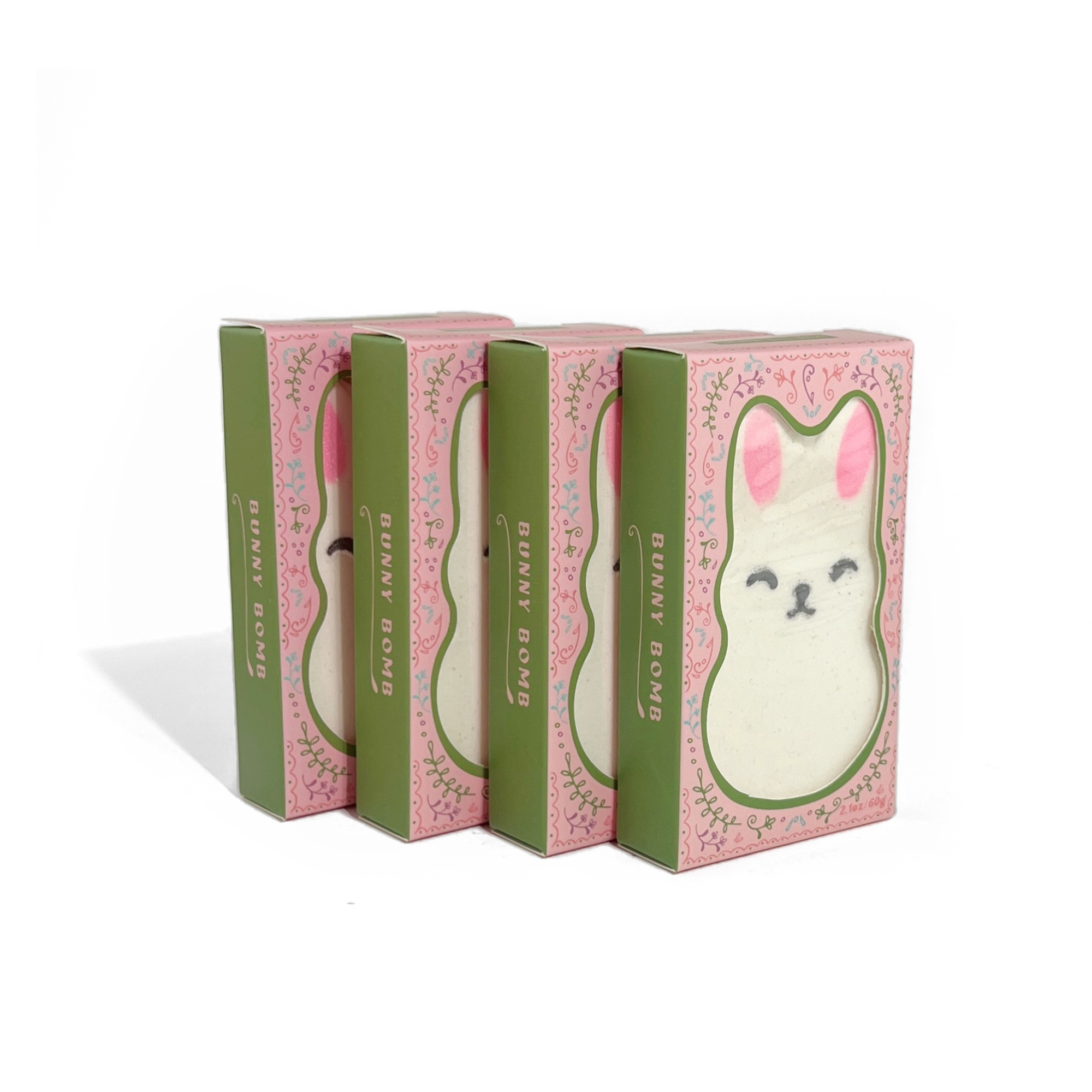 Stack of boxed Little Bunny Strawberry Bath Bombs with pastel packaging