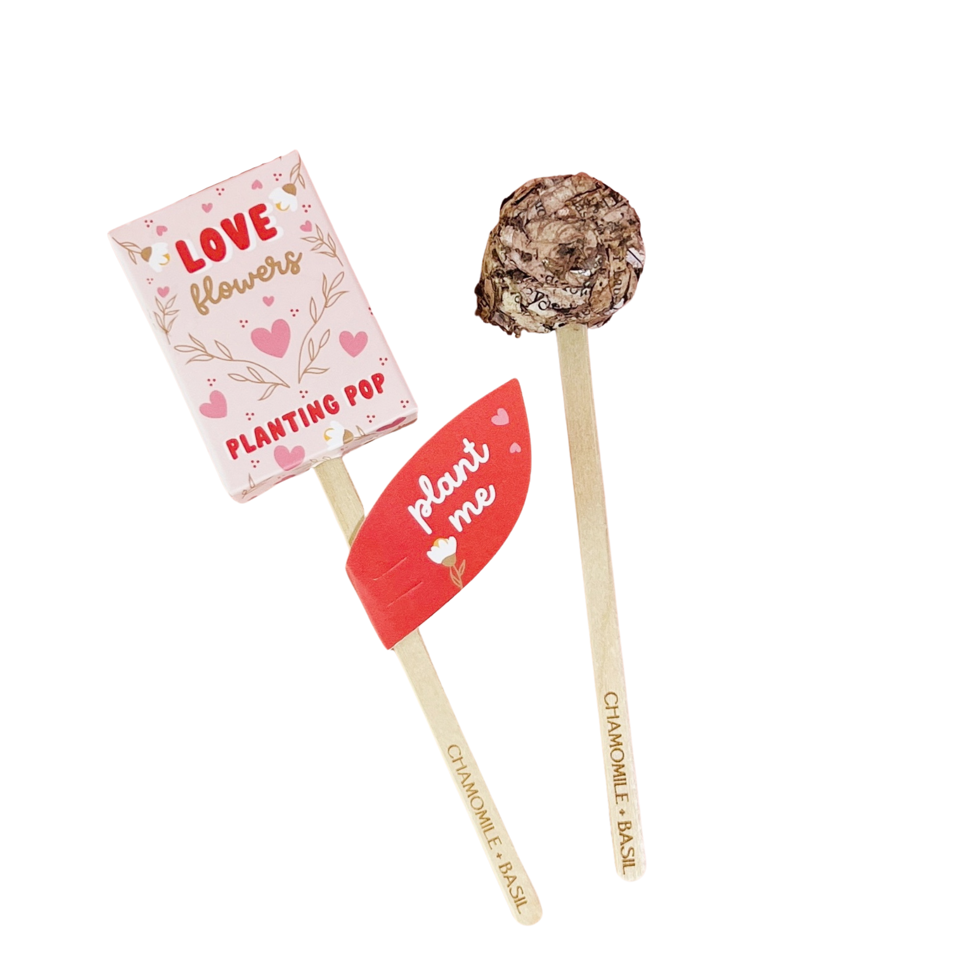 Two Love Flowers planting pops with pink heart packaging and chamomile basil seed label